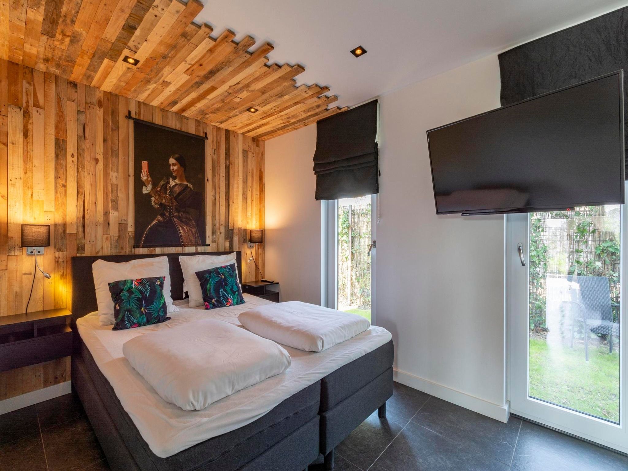 Een slaapkamer van Luxe Villa Keizerskroon - Keizerkroon 63 in Julianadorp aan Zee