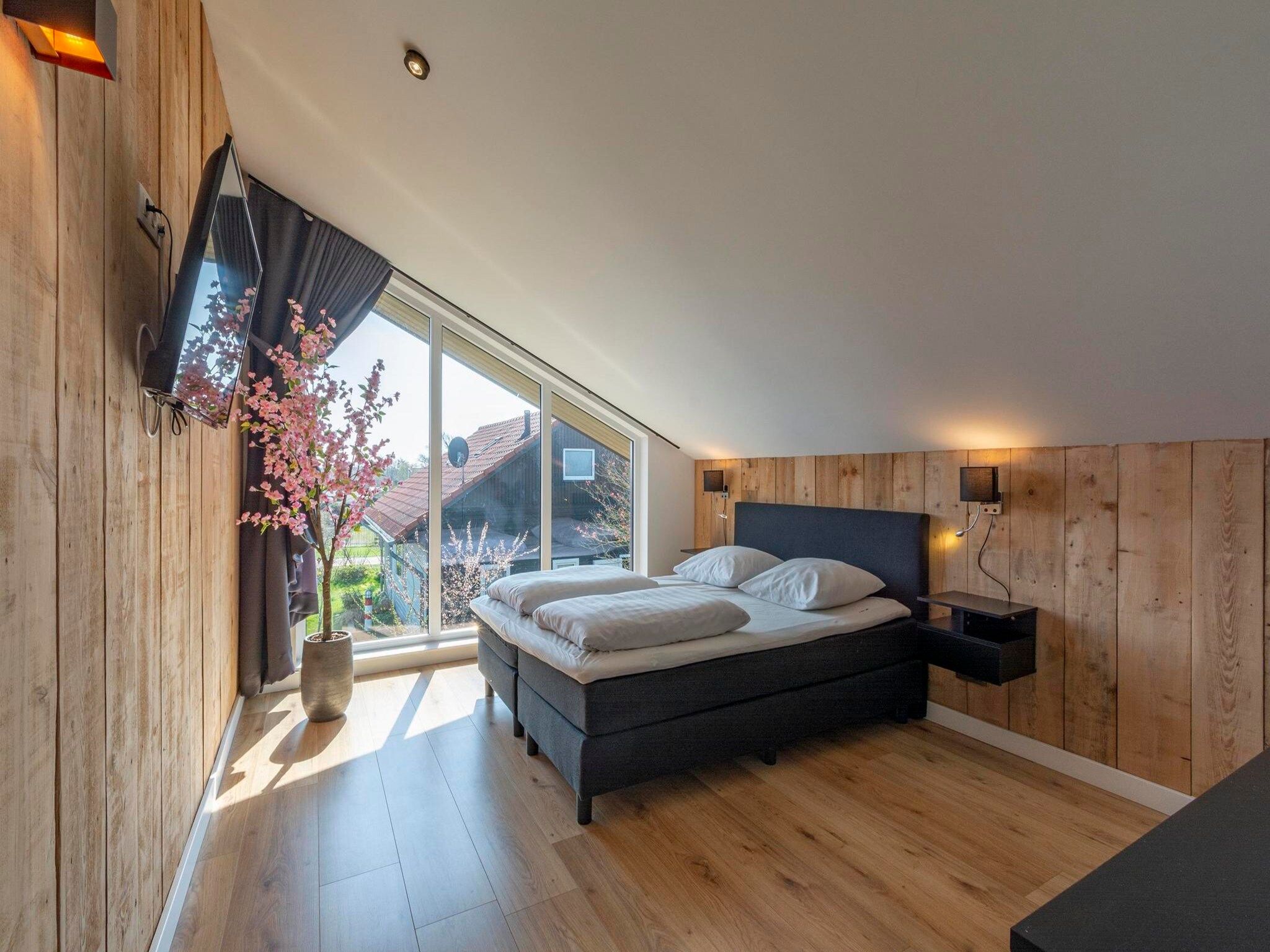 Een slaapkamer van Luxe Villa Keizerskroon - Keizerkroon 63 in Julianadorp aan Zee