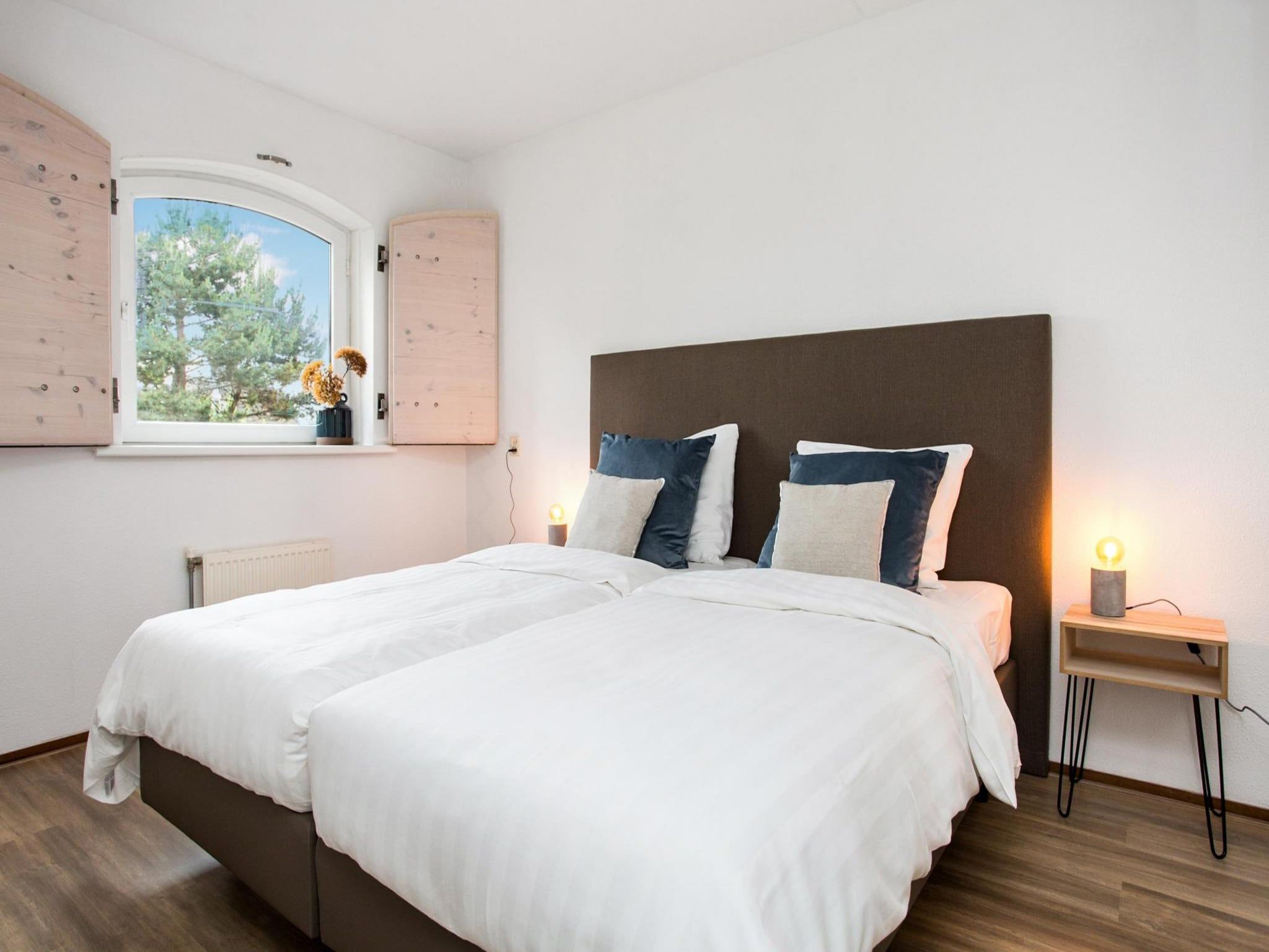 Een slaapkamer van Résidence Juliana 57 in Julianadorp aan Zee