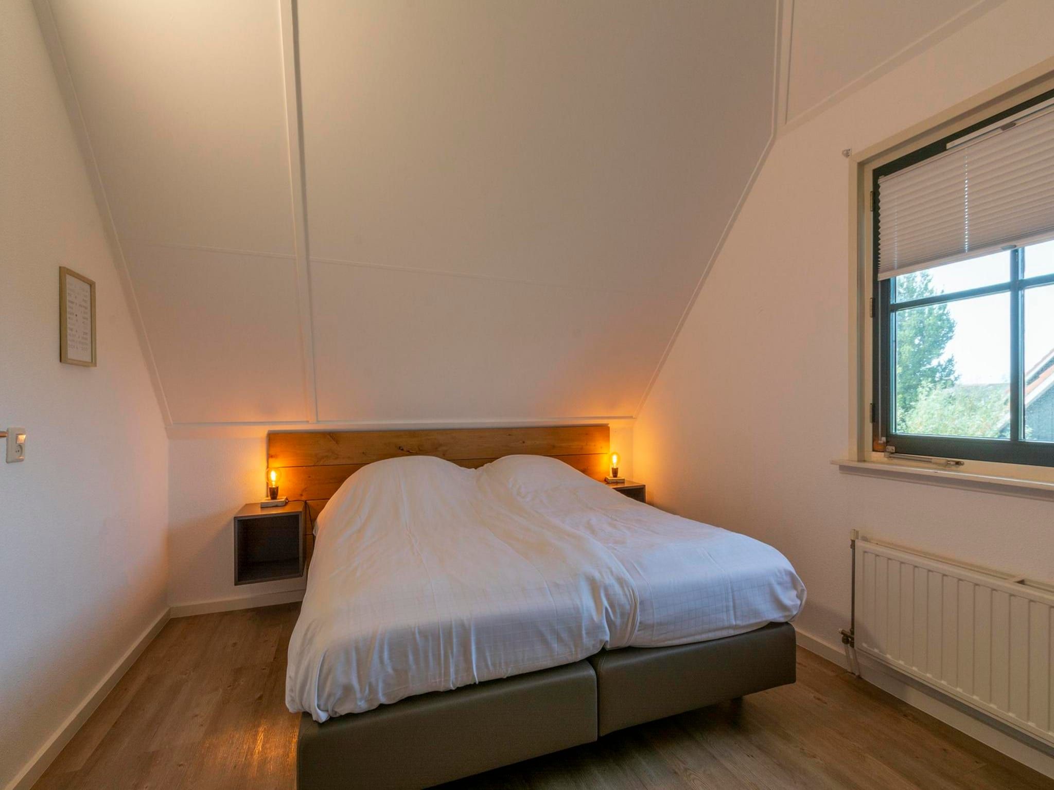 Een slaapkamer van De Buitenplaats 89 in Callantsoog