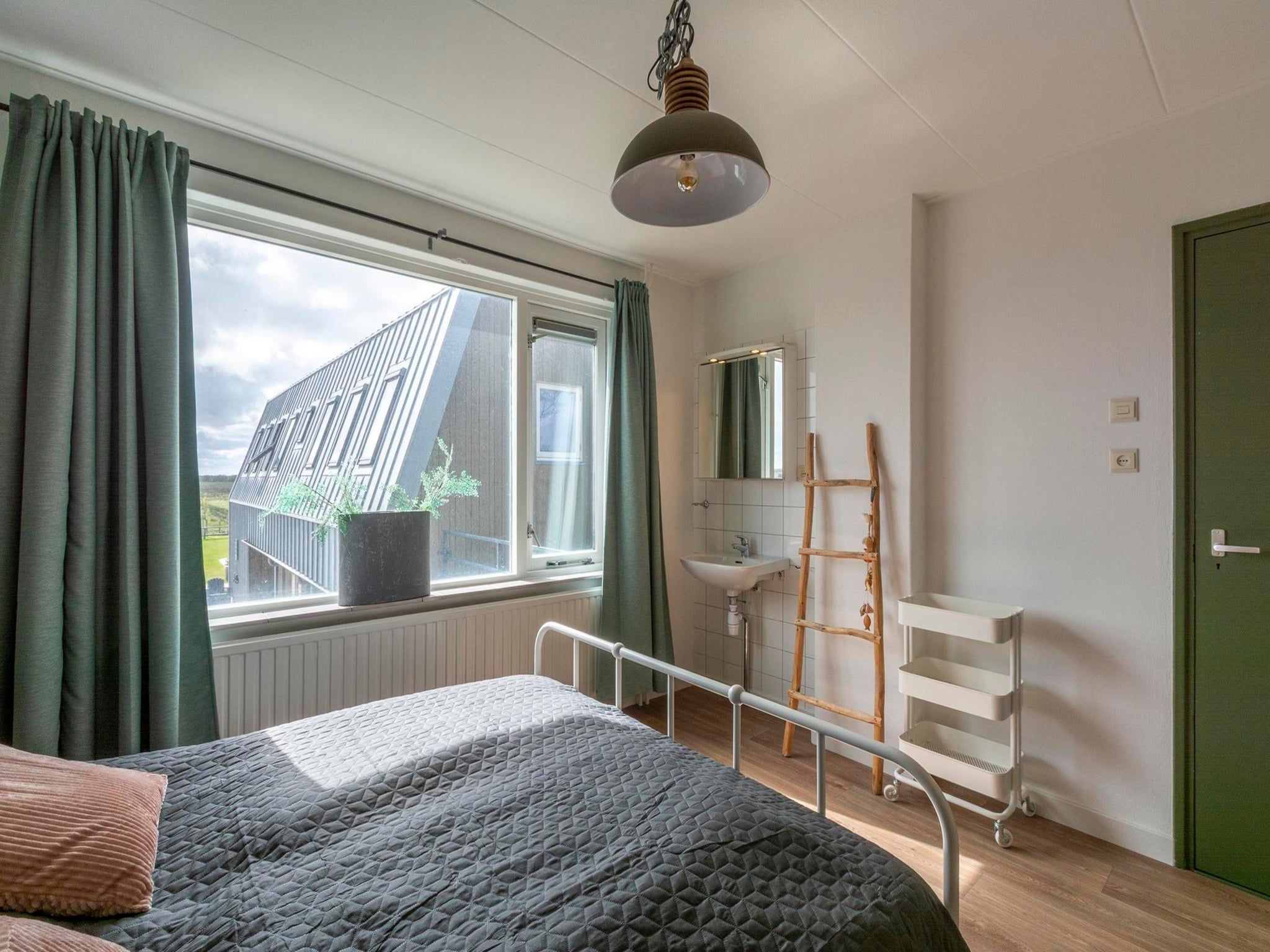 Een slaapkamer van Villa Zuidwester in Callantsoog