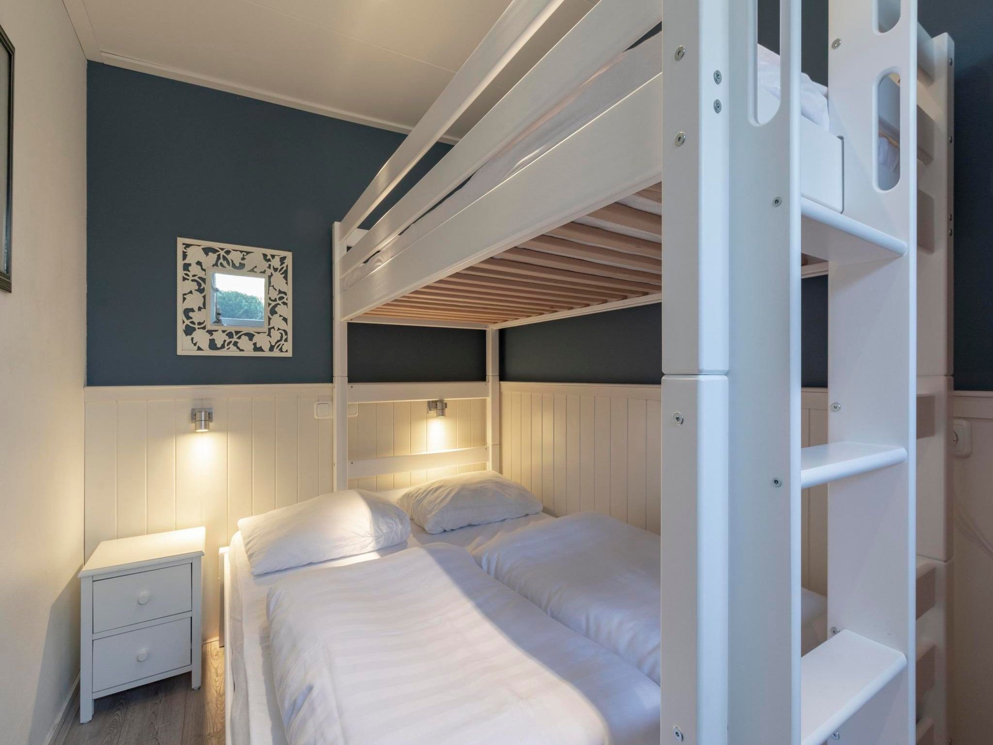 Een slaapkamer van Duinland 183 in Sint Maartenszee