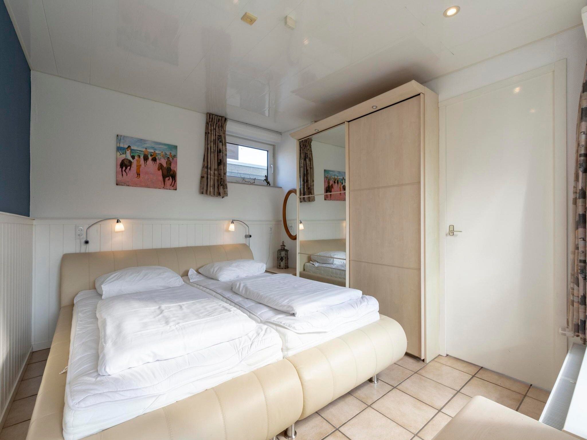 Een slaapkamer van Duinland 183 in Sint Maartenszee