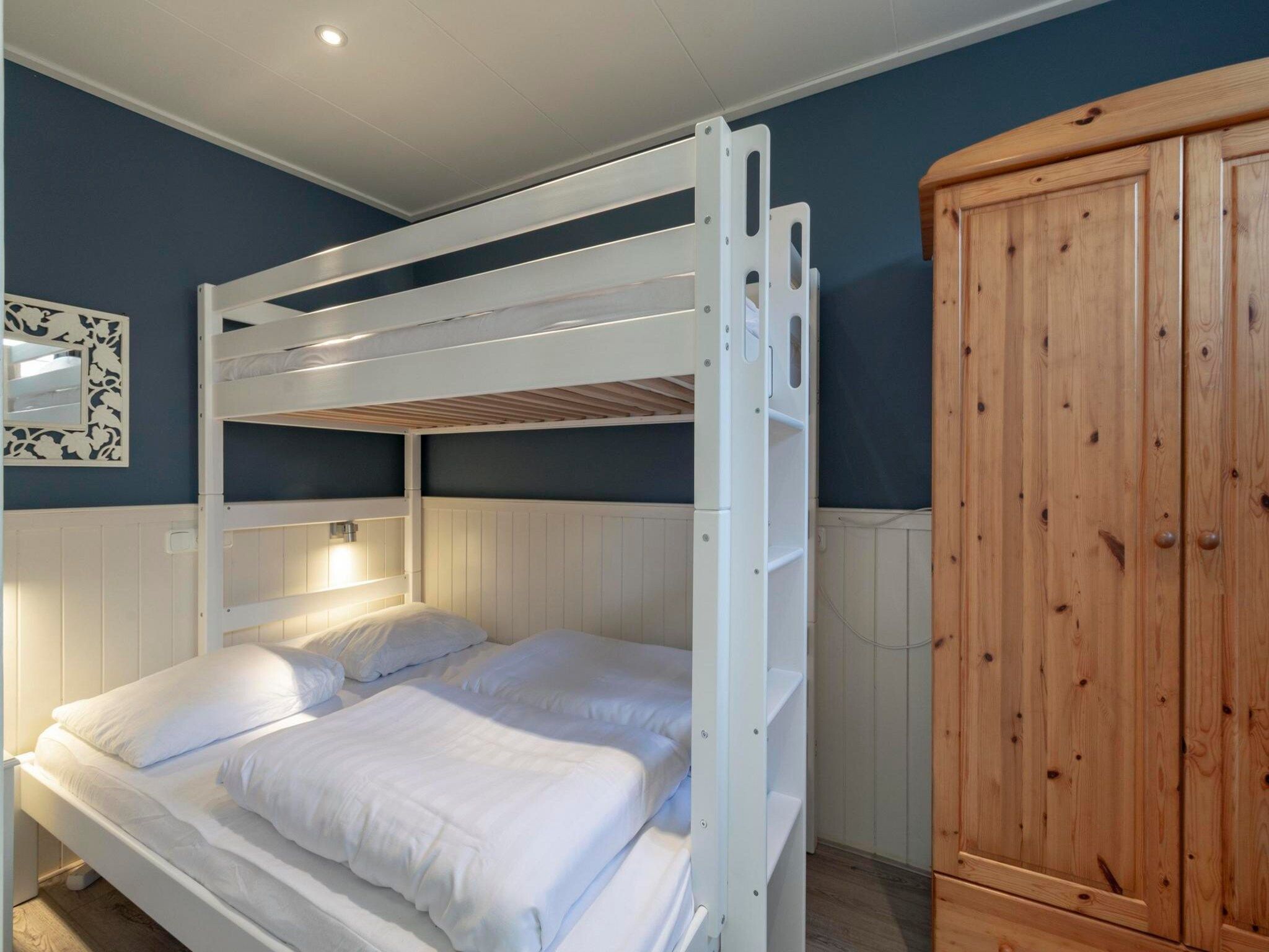 Een slaapkamer van Duinland 183 in Sint Maartenszee