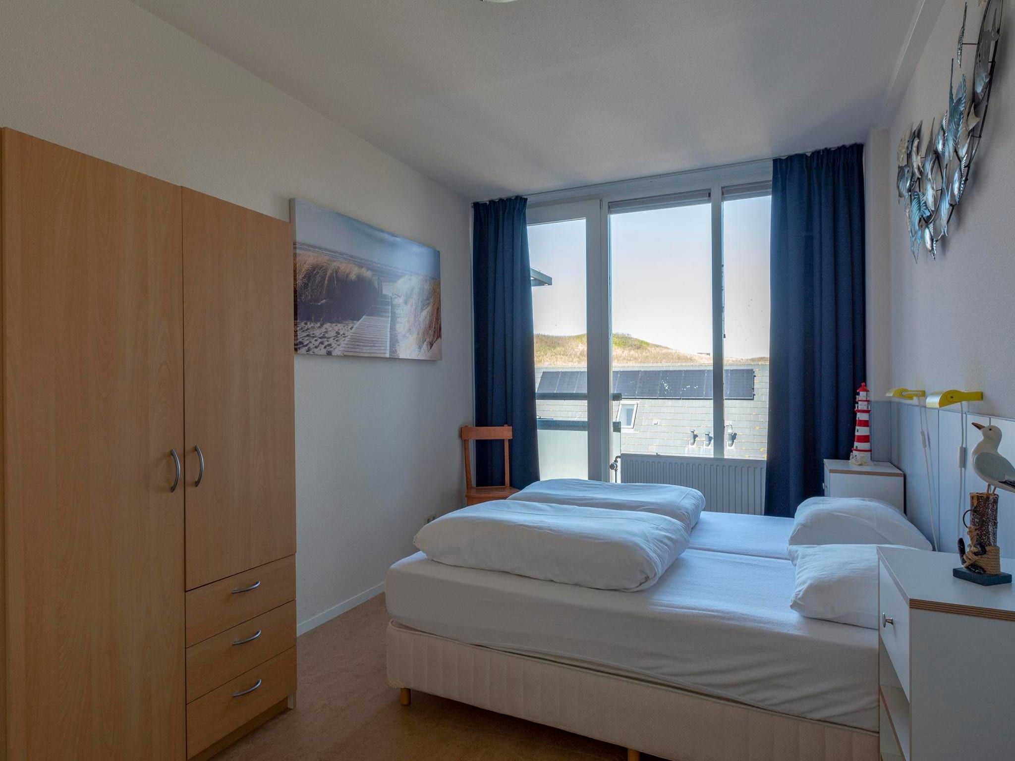 Een slaapkamer van Dorpsplein 23E in Callantsoog