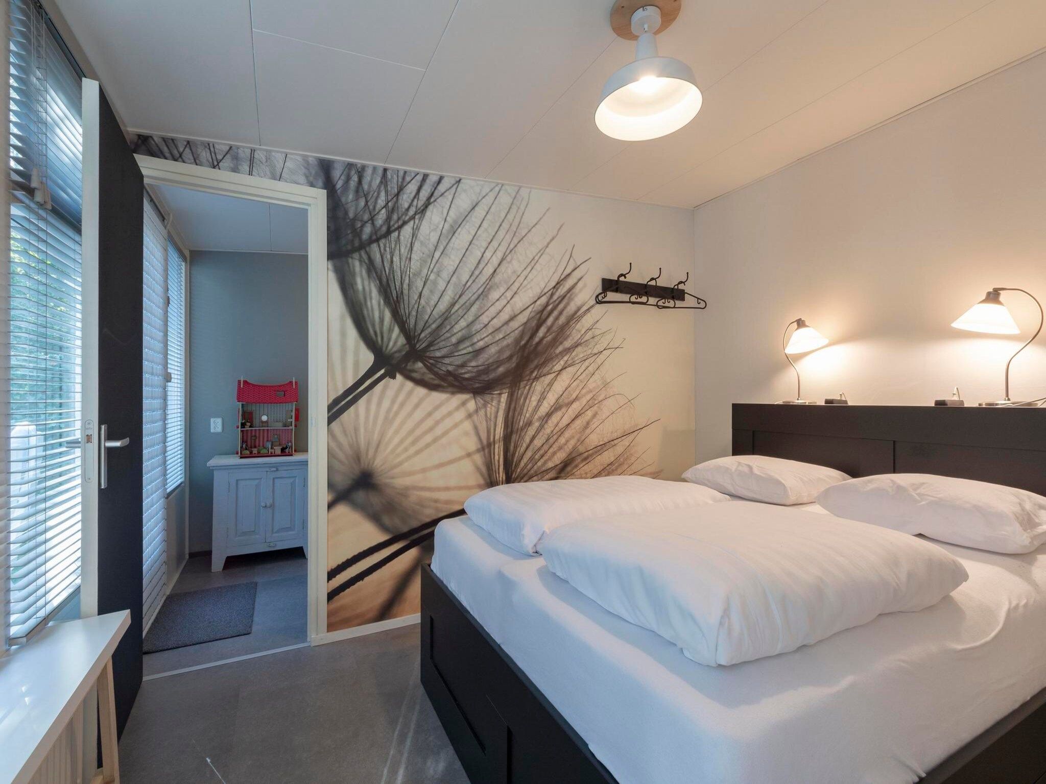 Een slaapkamer van Duinland 110 in Sint Maartenszee