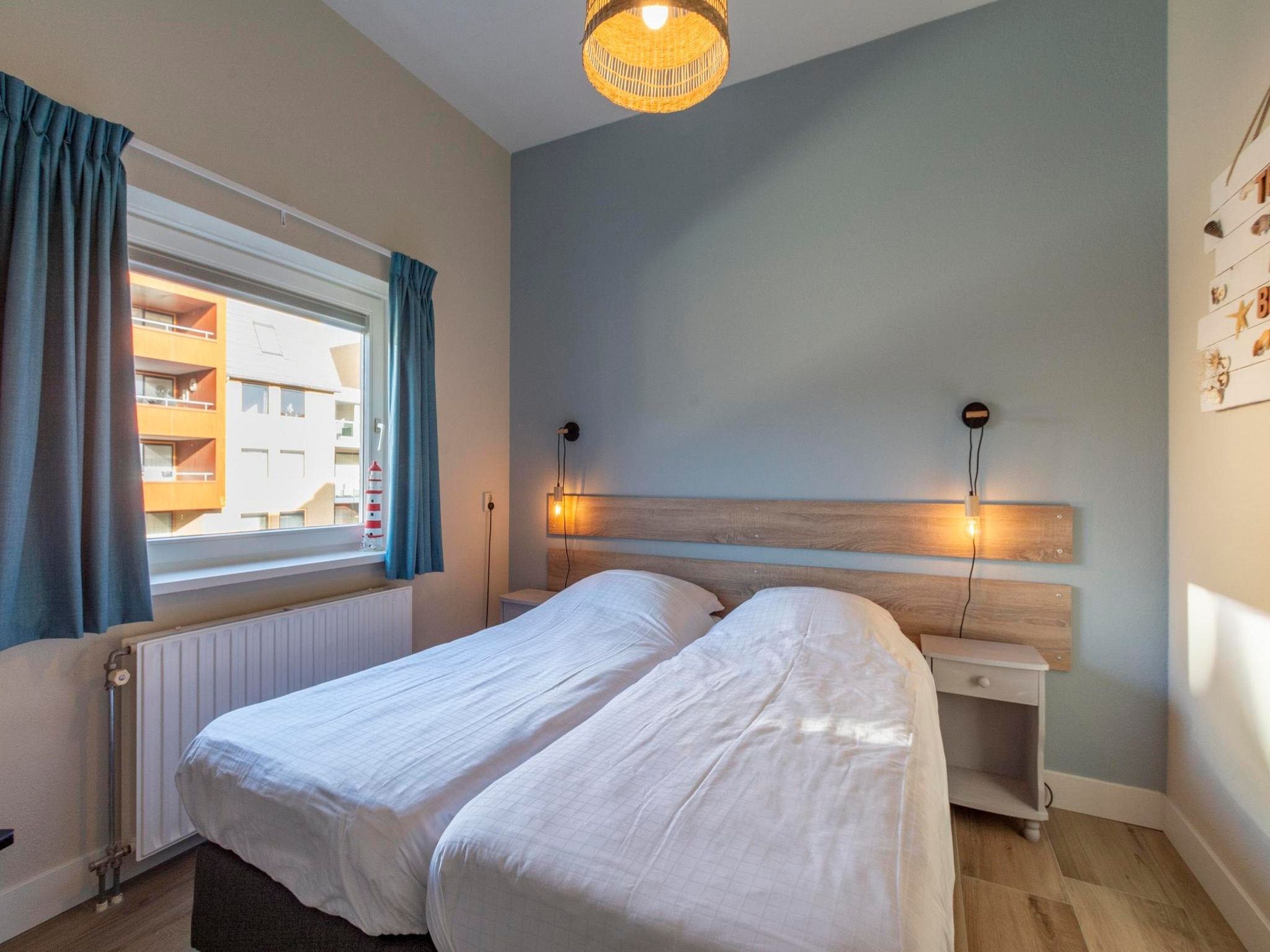 Een slaapkamer van Wijde Blick 112 in Callantsoog