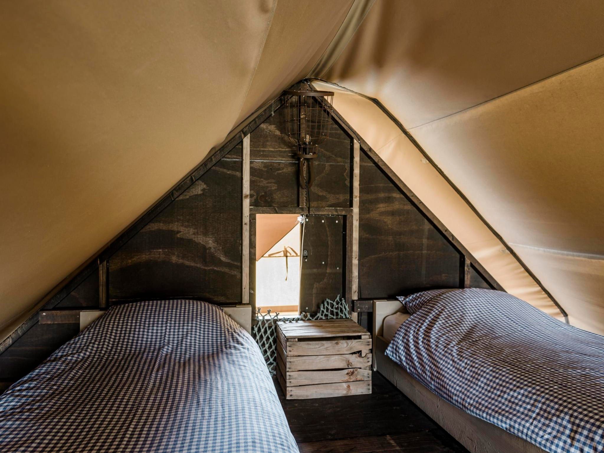 Een slaapkamer van Beach Lodge - Duynpark in Callantsoog