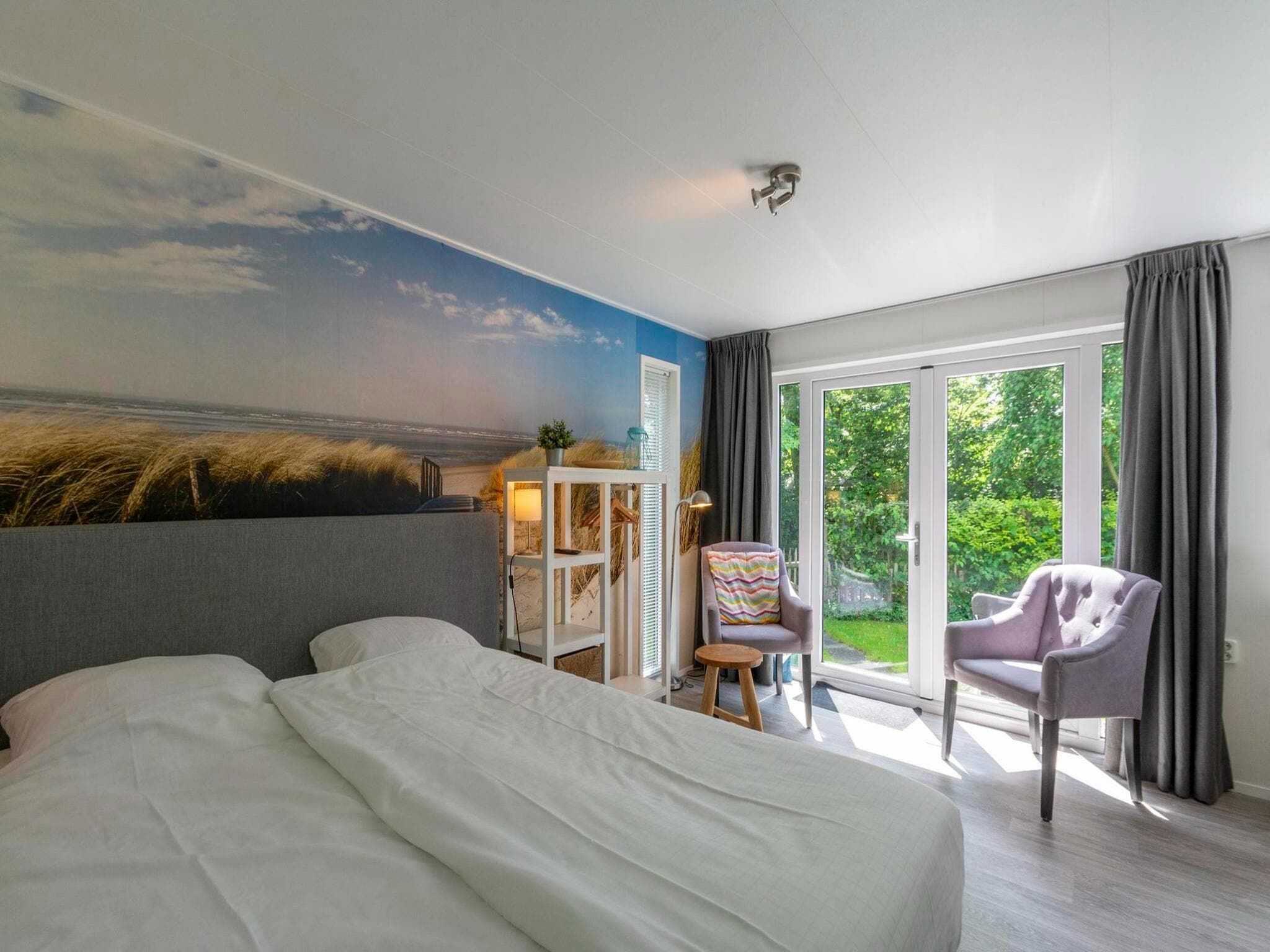 Een slaapkamer van Beach Studio Campanula in Sint Maartenszee