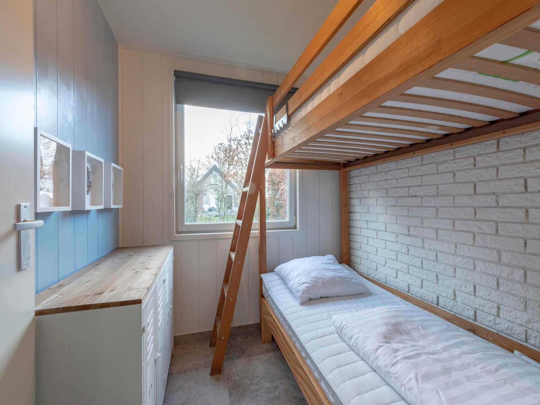 Een slaapkamer van Belkmerduinen 12 in Sint Maartenszee