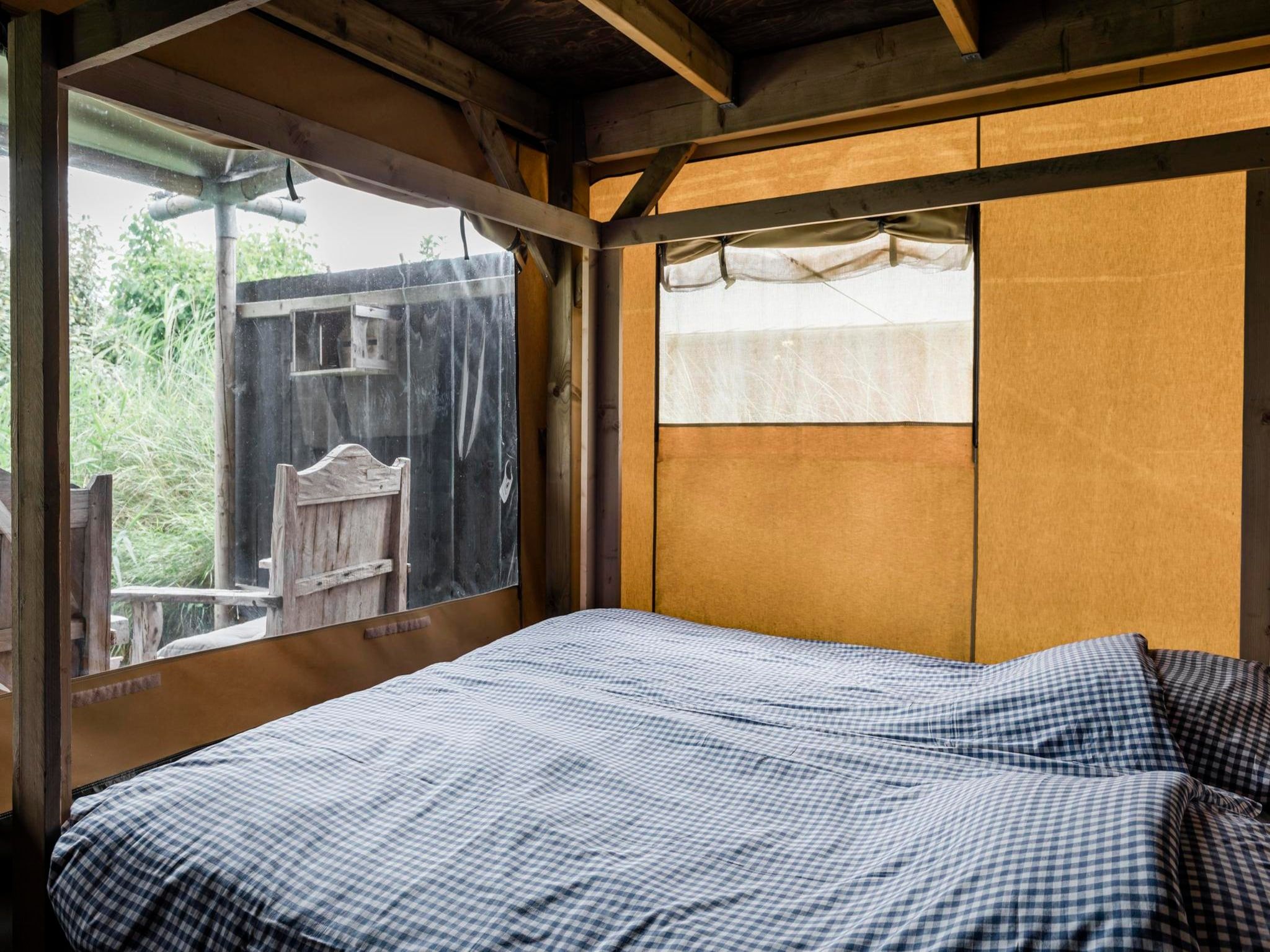 Een slaapkamer van Wood Lodge - Duynpark in Callantsoog