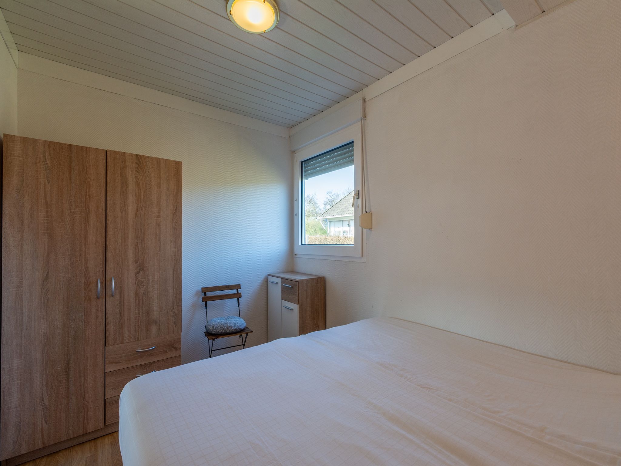 Een slaapkamer van Keizerskroon 58 in Julianadorp aan Zee