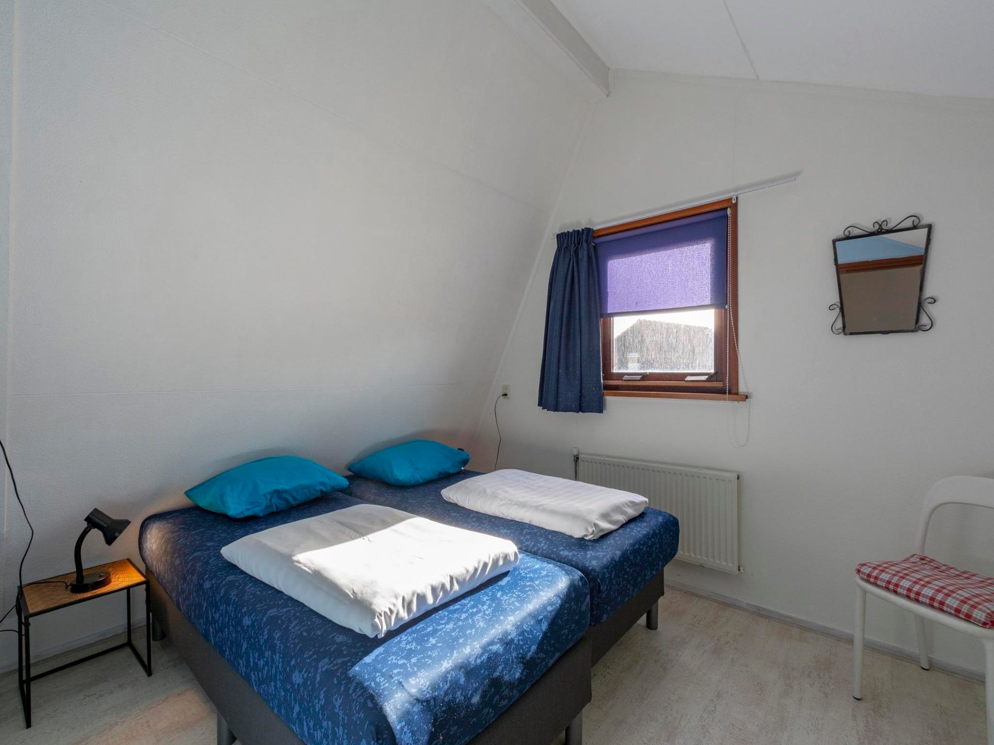 Een slaapkamer van Yperhof 66 in Julianadorp aan Zee