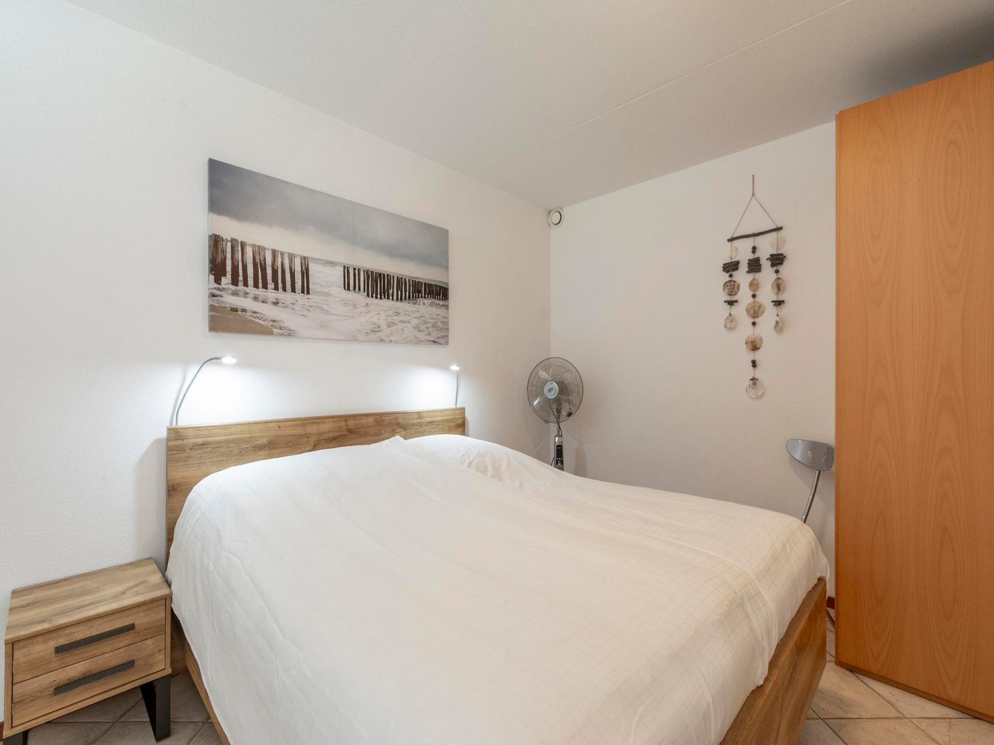 Een slaapkamer van Wijde Blick 211 in Callantsoog