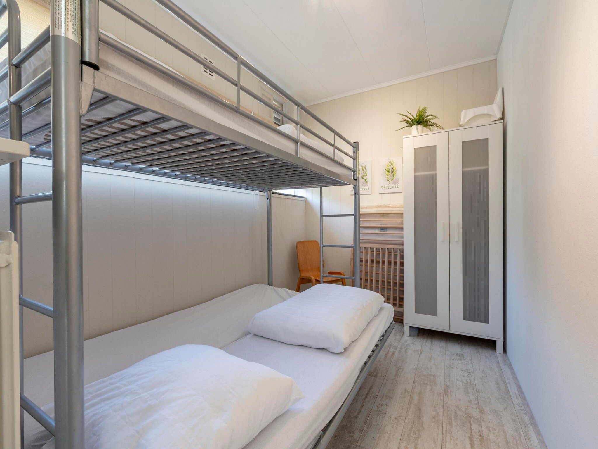 Een slaapkamer van Zeewaard 33 in Sint Maartenszee