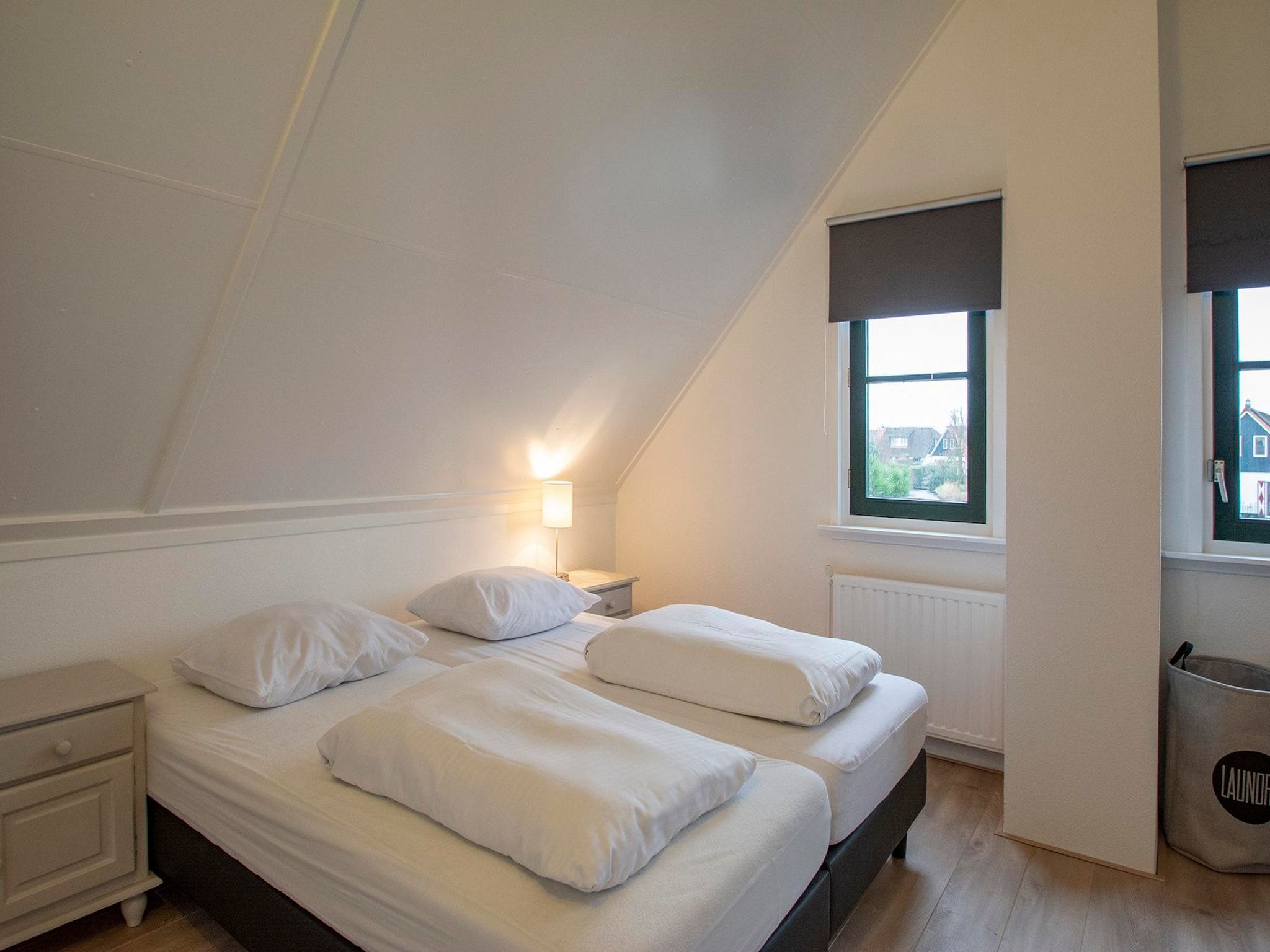 Een slaapkamer van De Buitenplaats 42 in Callantsoog