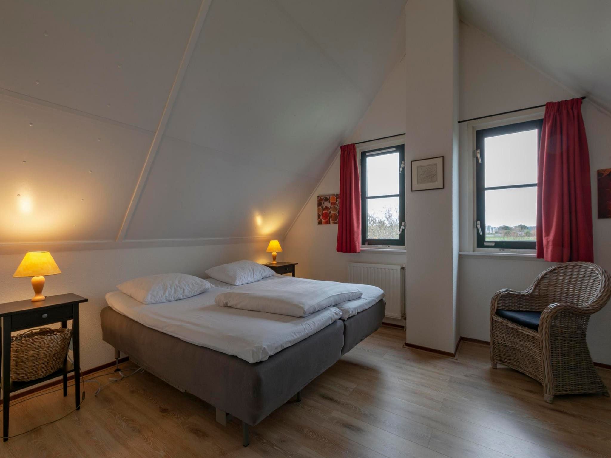 Een slaapkamer van De Buitenplaats 7 in Callantsoog
