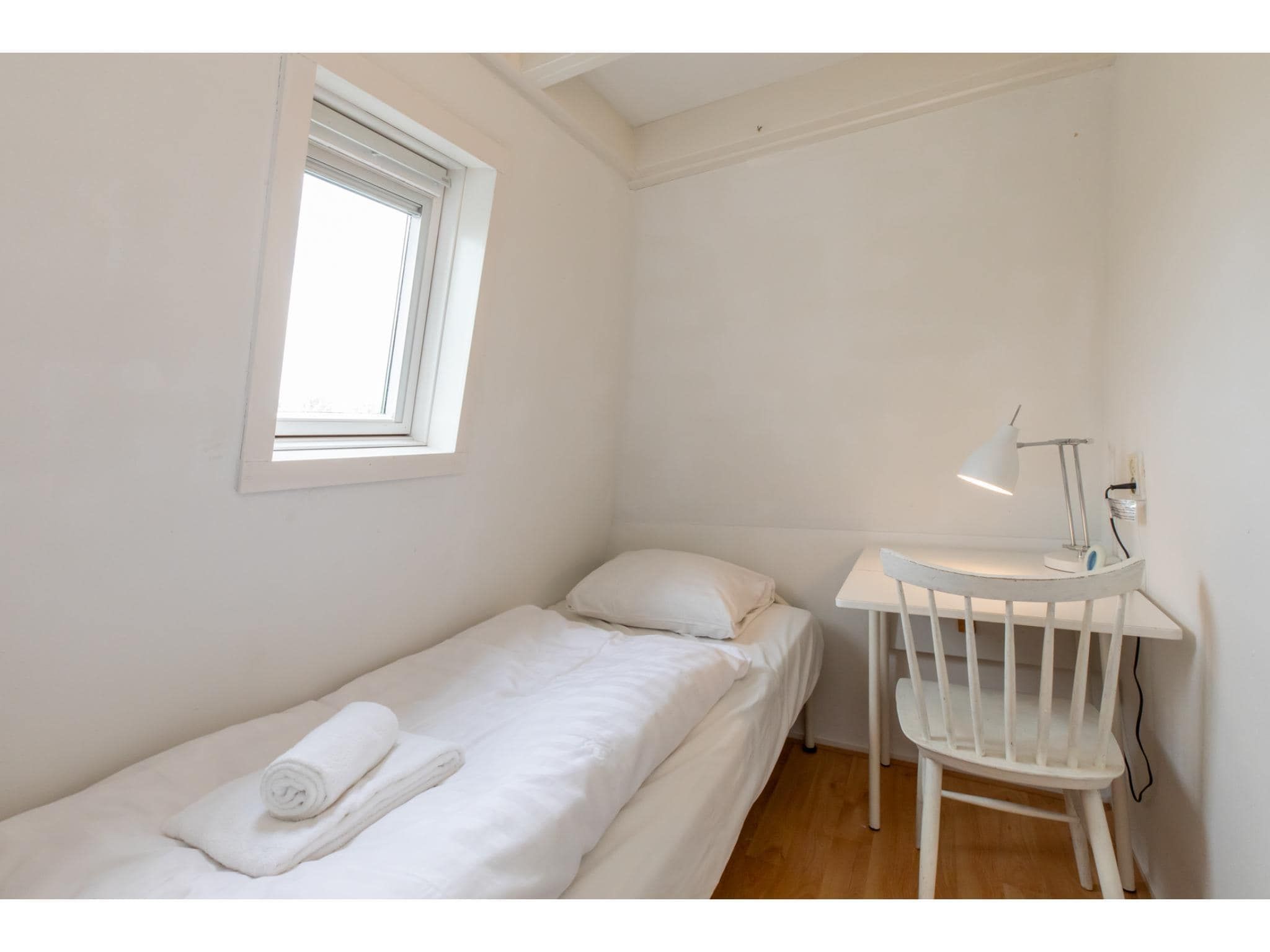 Een slaapkamer van Strandhuis Schoneveld in Breskens