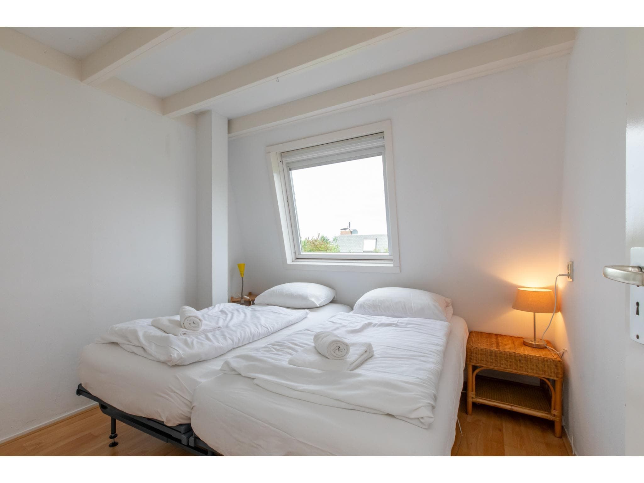 Een slaapkamer van Strandhuis Schoneveld in Breskens