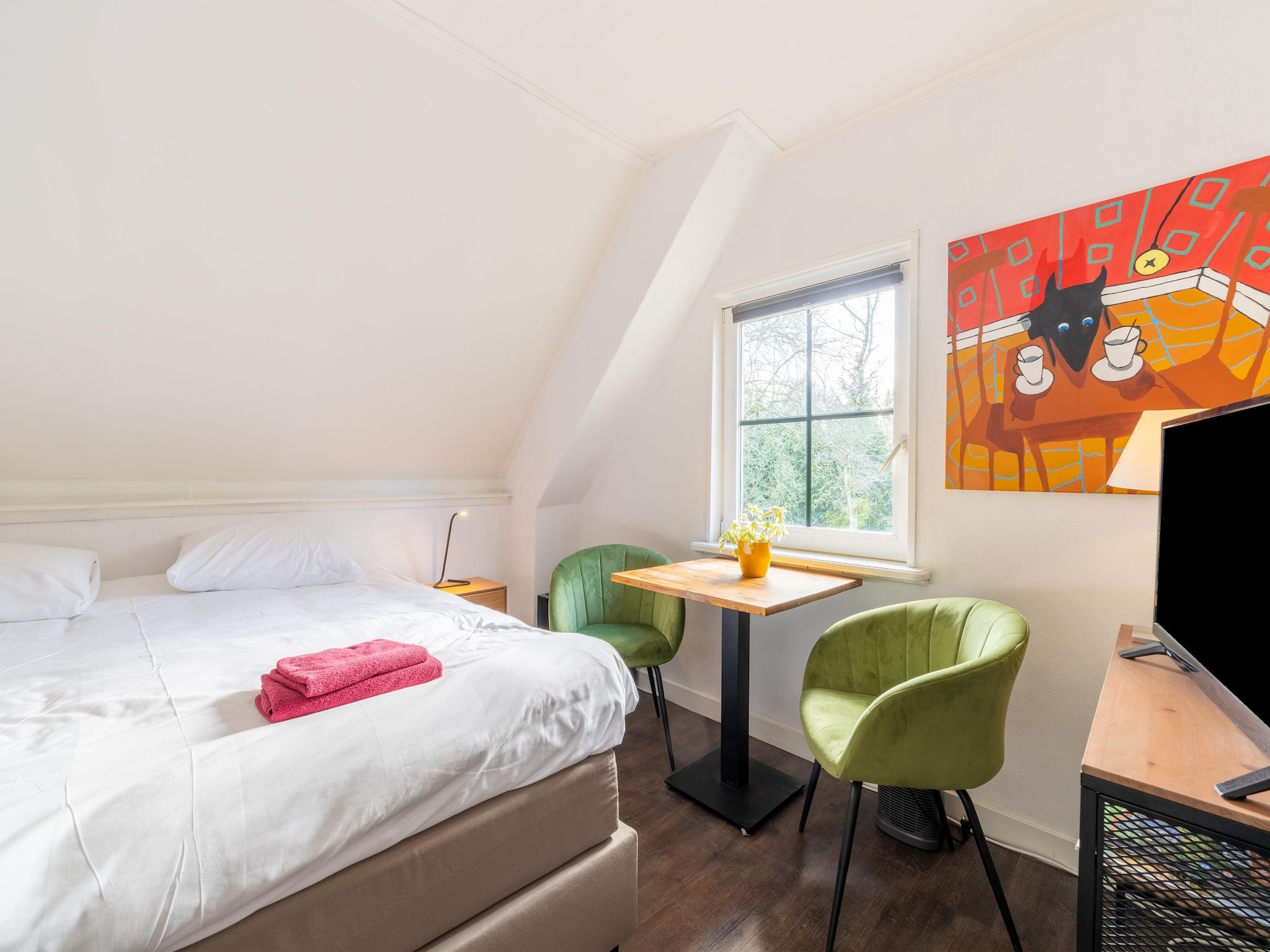 Een slaapkamer van Landhuis Hezenes in Diever