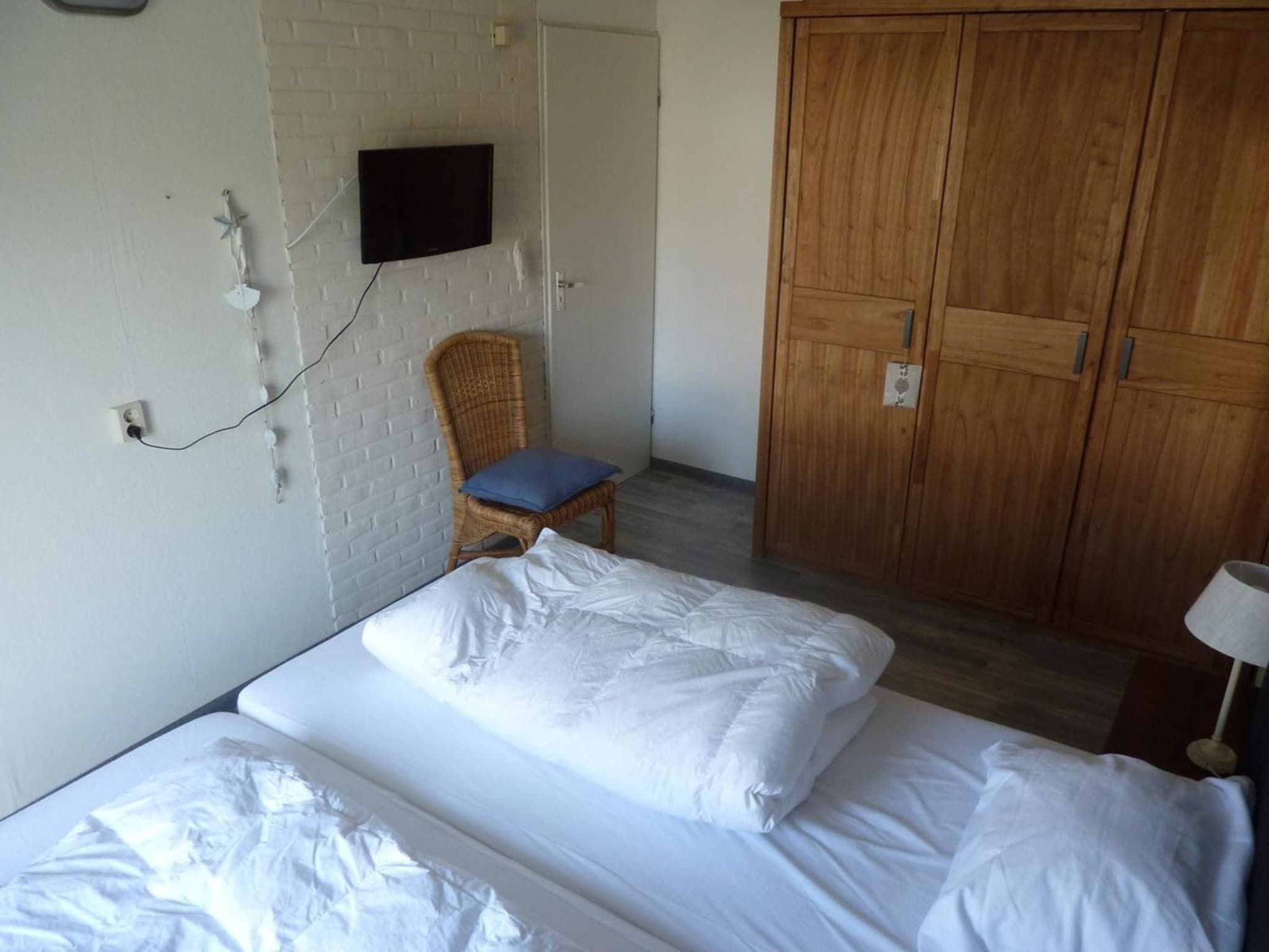 Een slaapkamer van Schoneveld 11 Zeester Breskens in Breskens