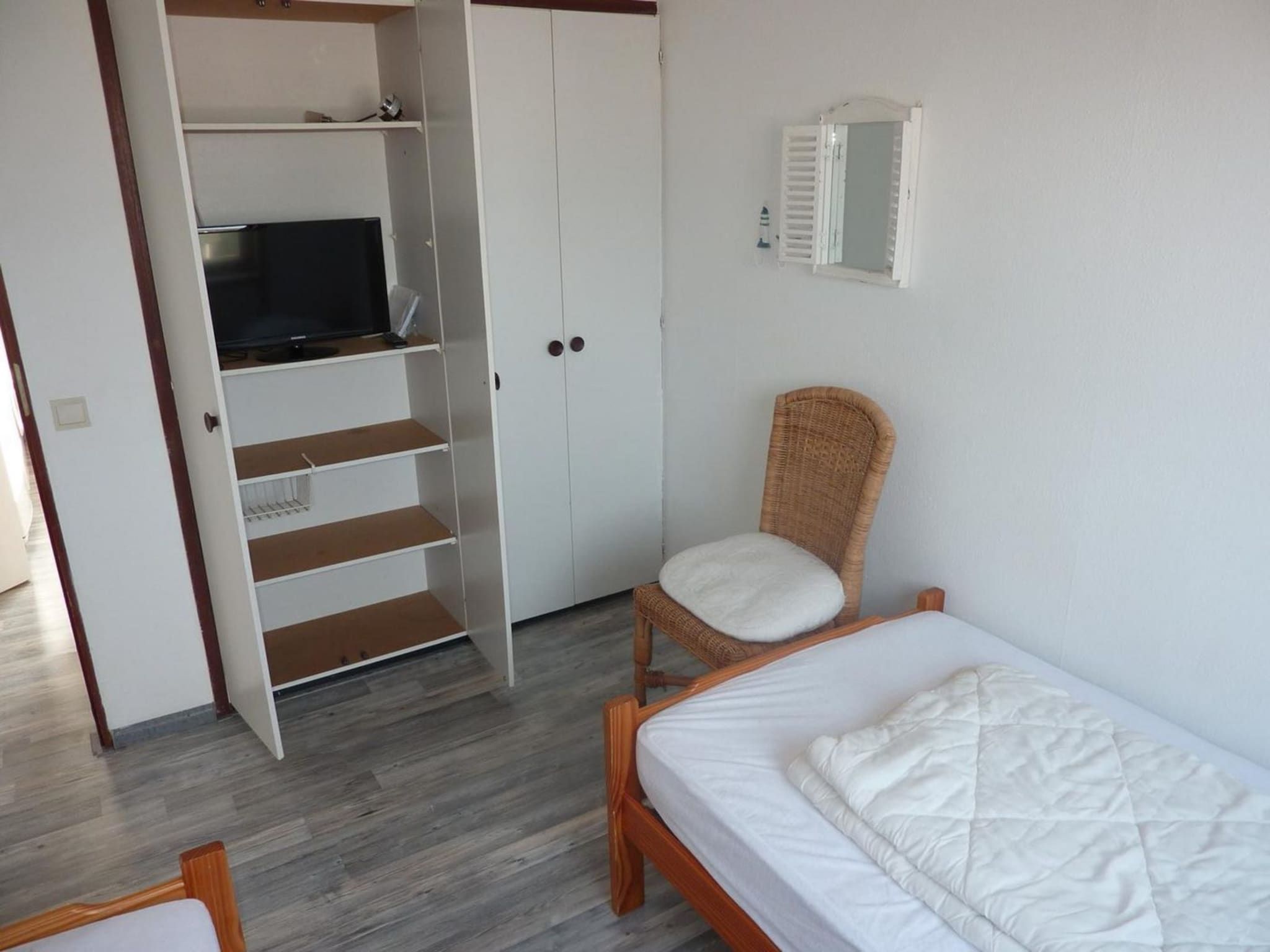 Een slaapkamer van Schoneveld 11 Zeester Breskens in Breskens