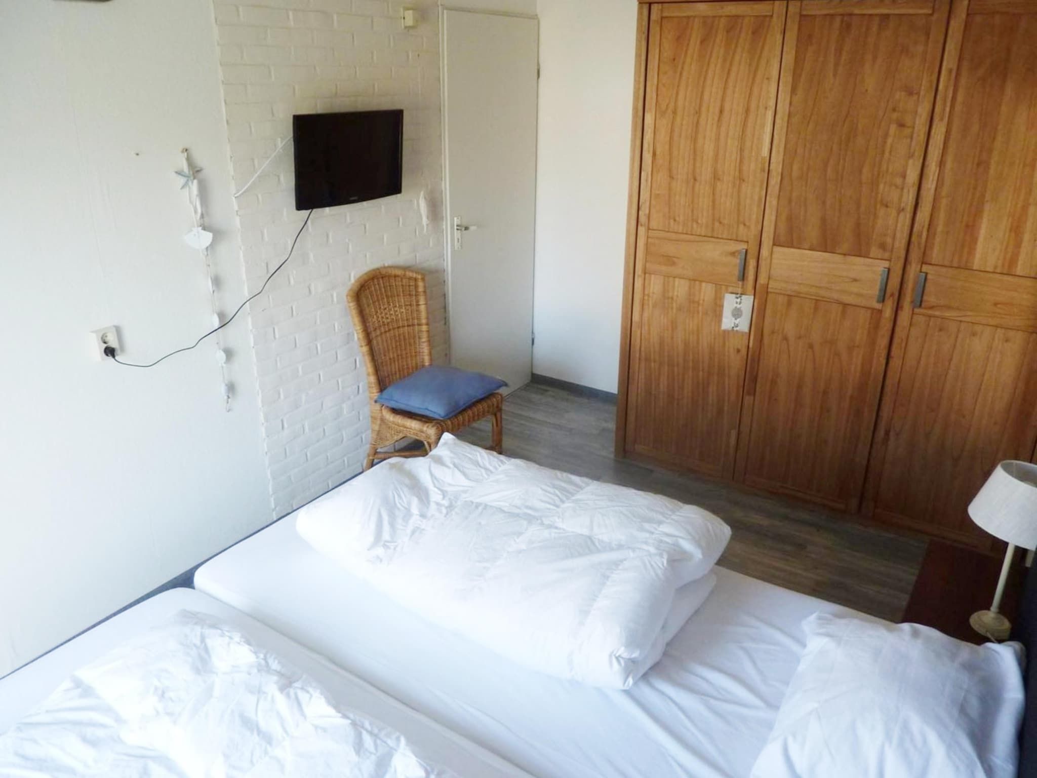 Een slaapkamer van Schoneveld 11 Zeester Breskens in Breskens