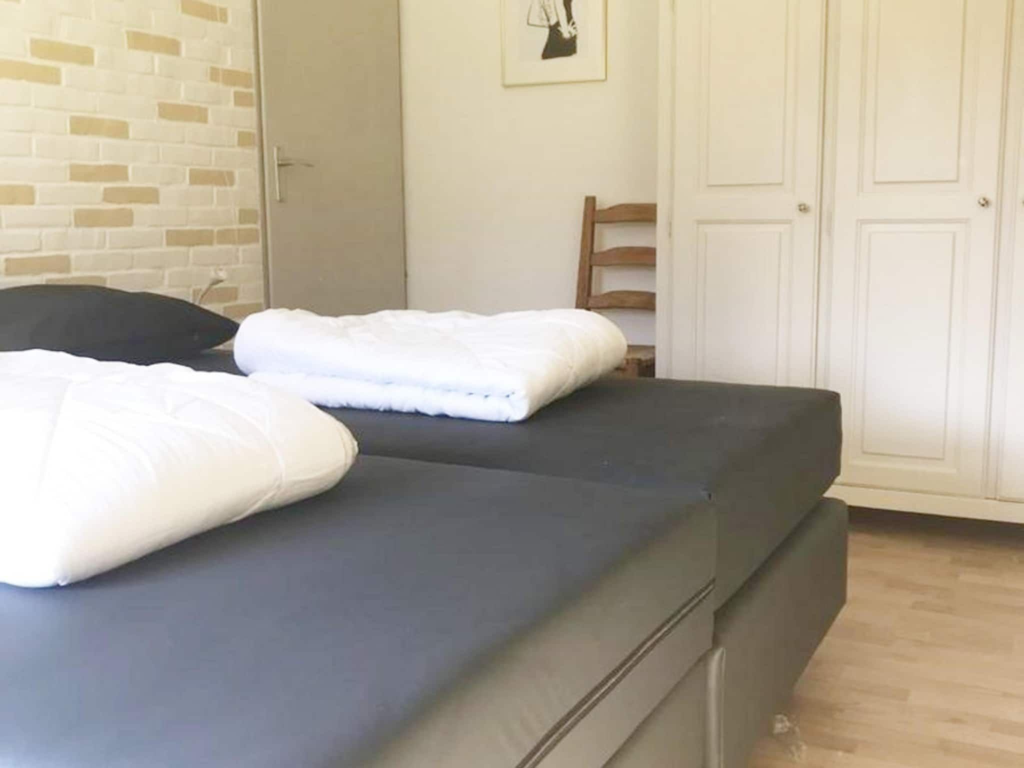Een slaapkamer van Schoneveld 60 Zeester Breskens in Breskens