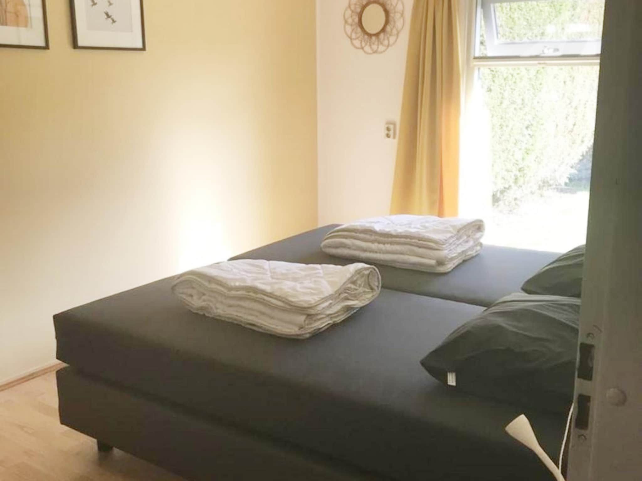 Een slaapkamer van Schoneveld 60 Zeester Breskens in Breskens