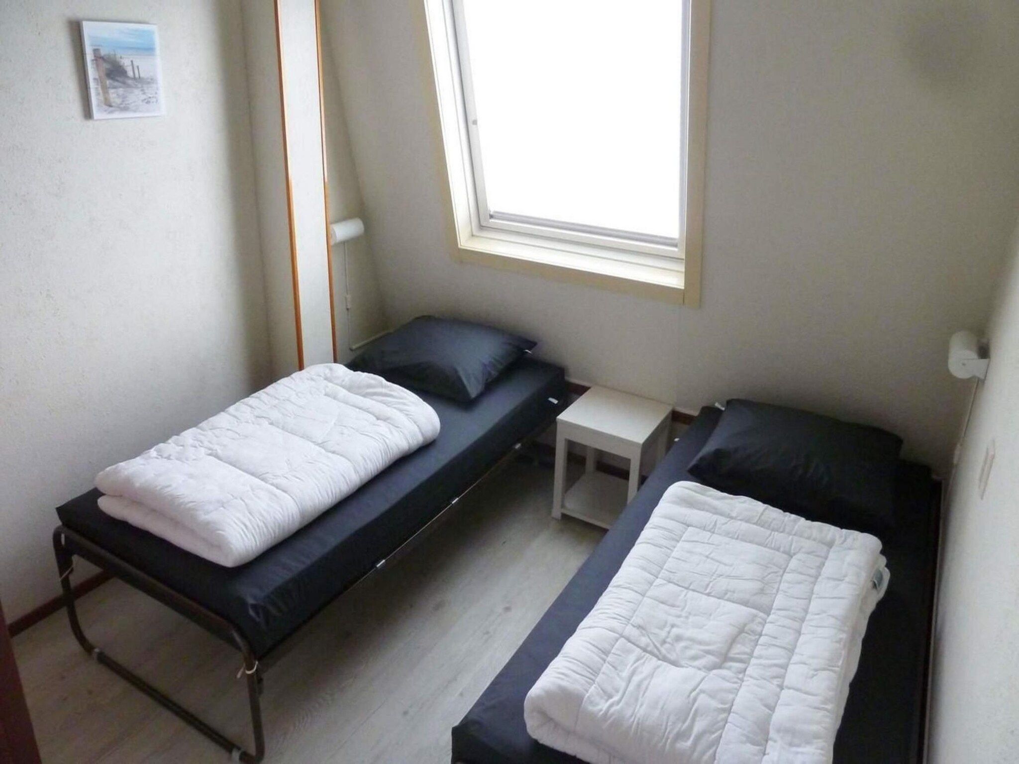 Een slaapkamer van Schoneveld 90 Zeester Breskens in Breskens