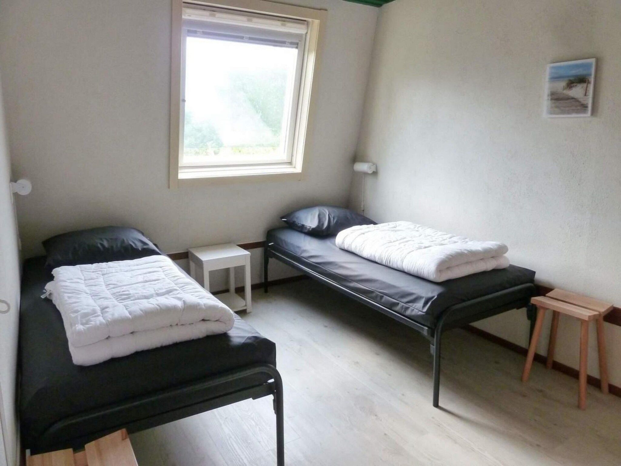 Een slaapkamer van Schoneveld 90 Zeester Breskens in Breskens
