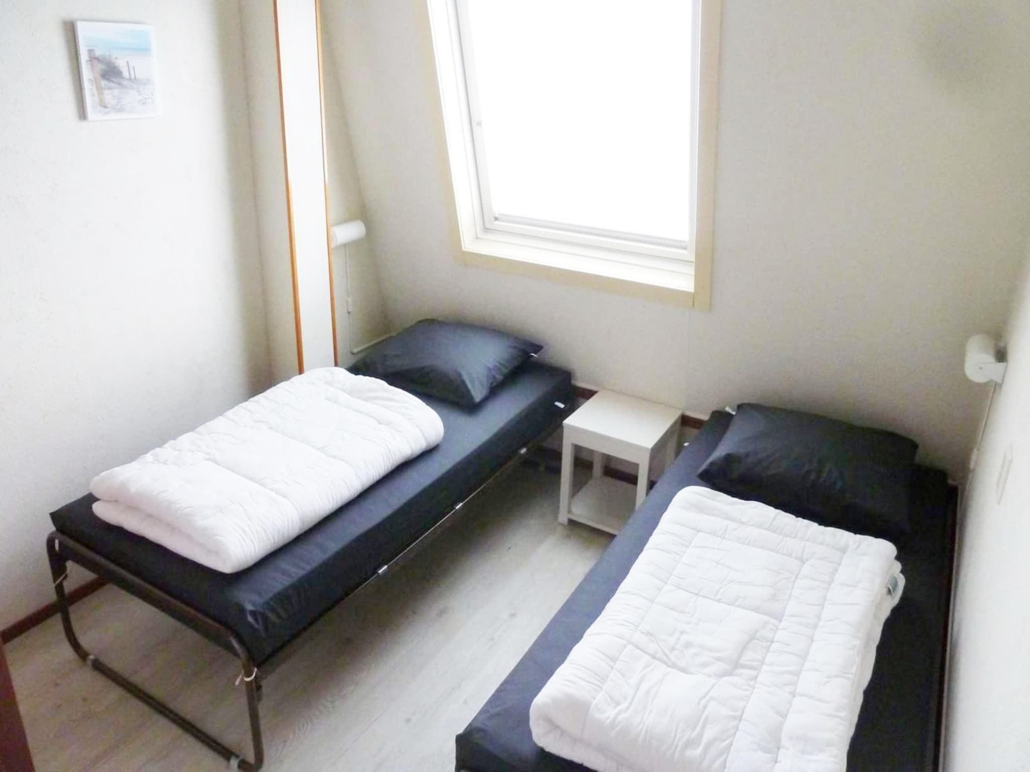 Een slaapkamer van Schoneveld 90 Zeester Breskens in Breskens
