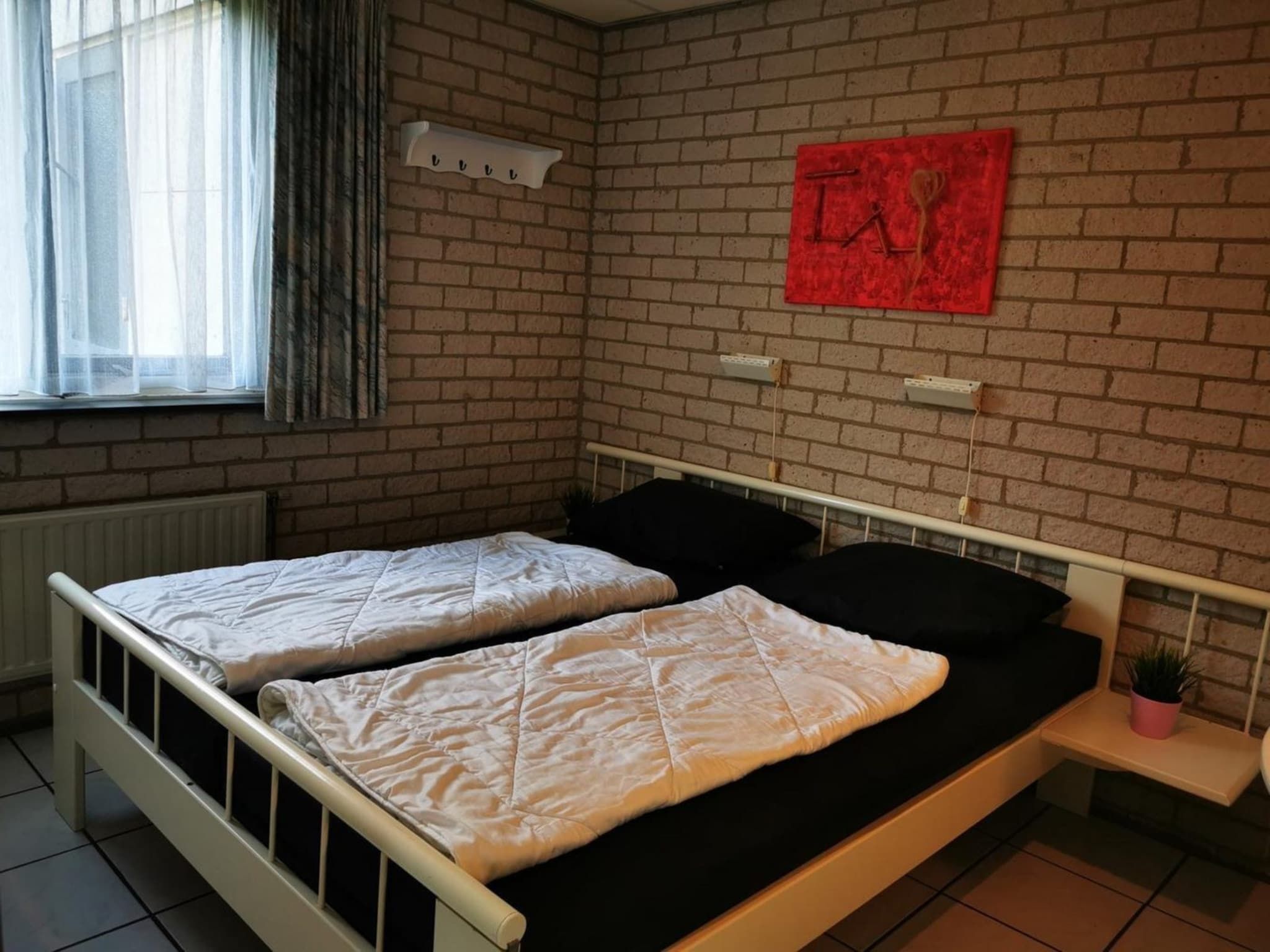 Een slaapkamer van Schoneveld 353 Strandparel Breskens in Breskens