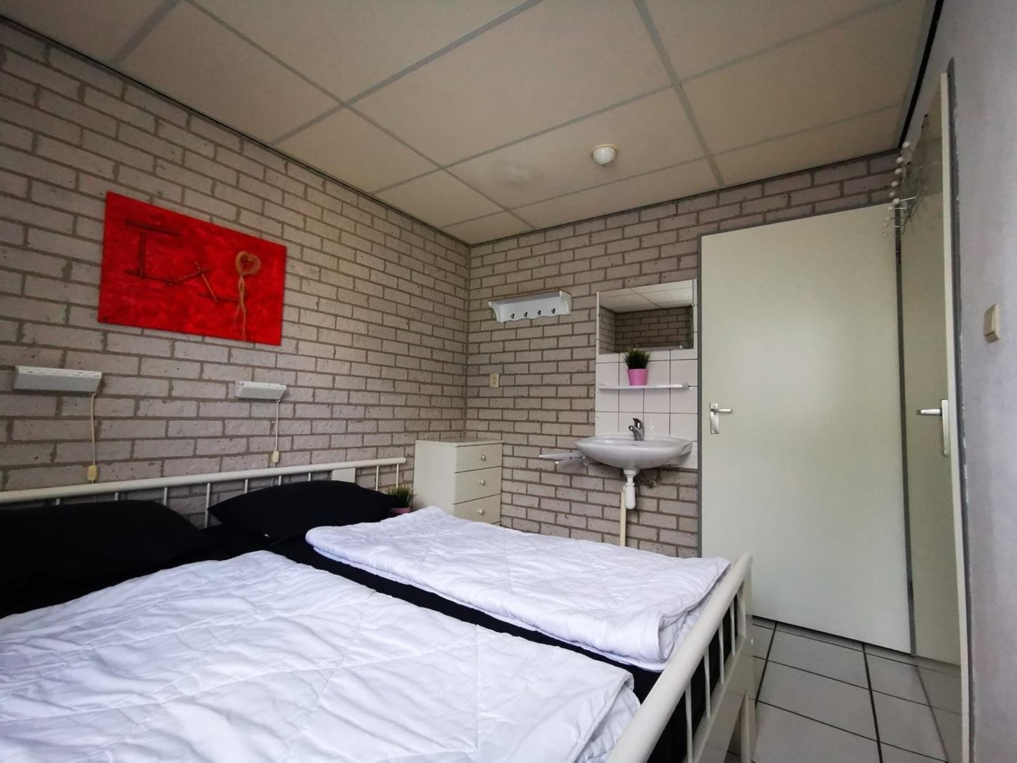Een slaapkamer van Schoneveld 353 Strandparel Breskens in Breskens