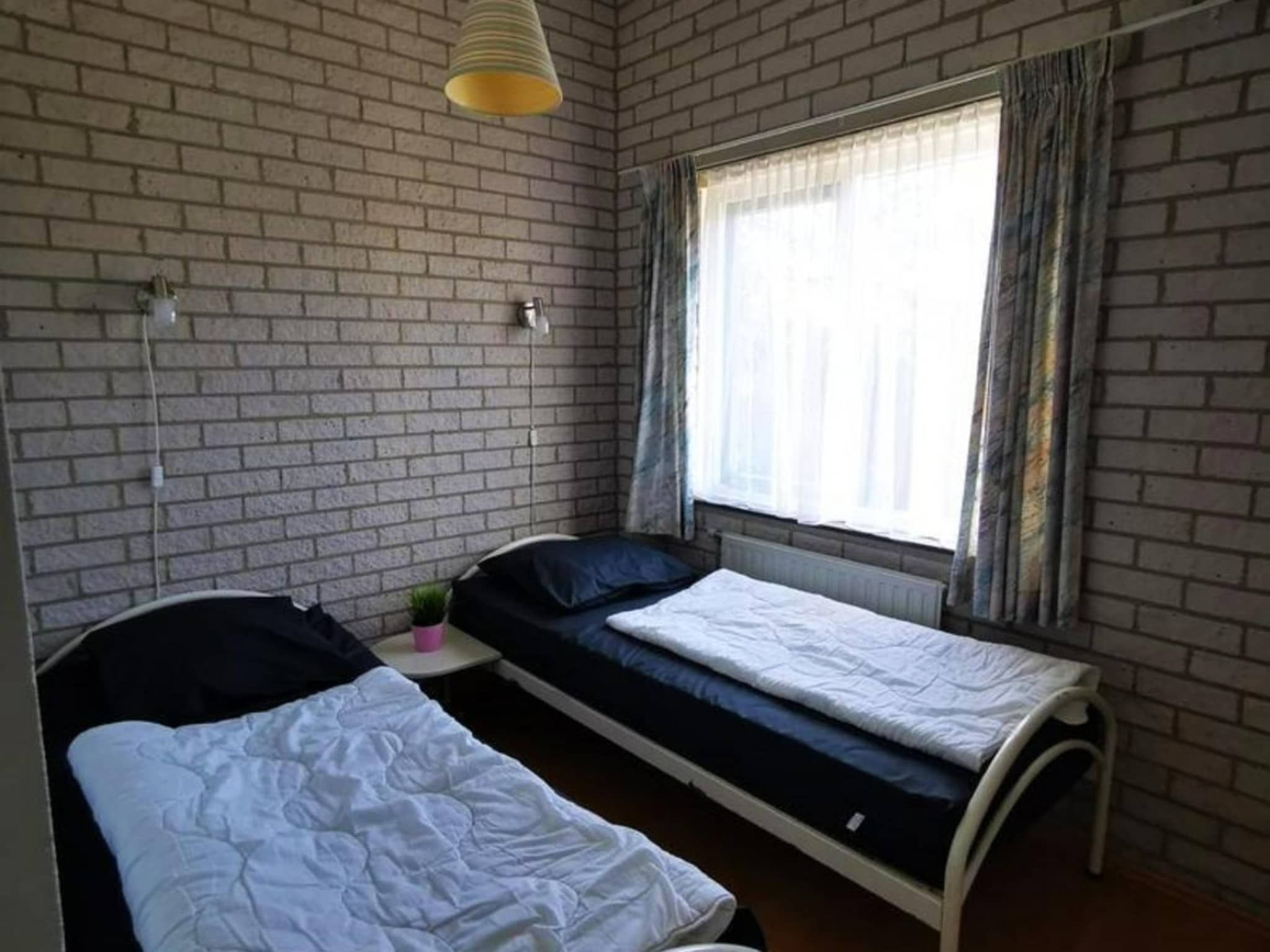 Een slaapkamer van Schoneveld 353 Strandparel Breskens in Breskens