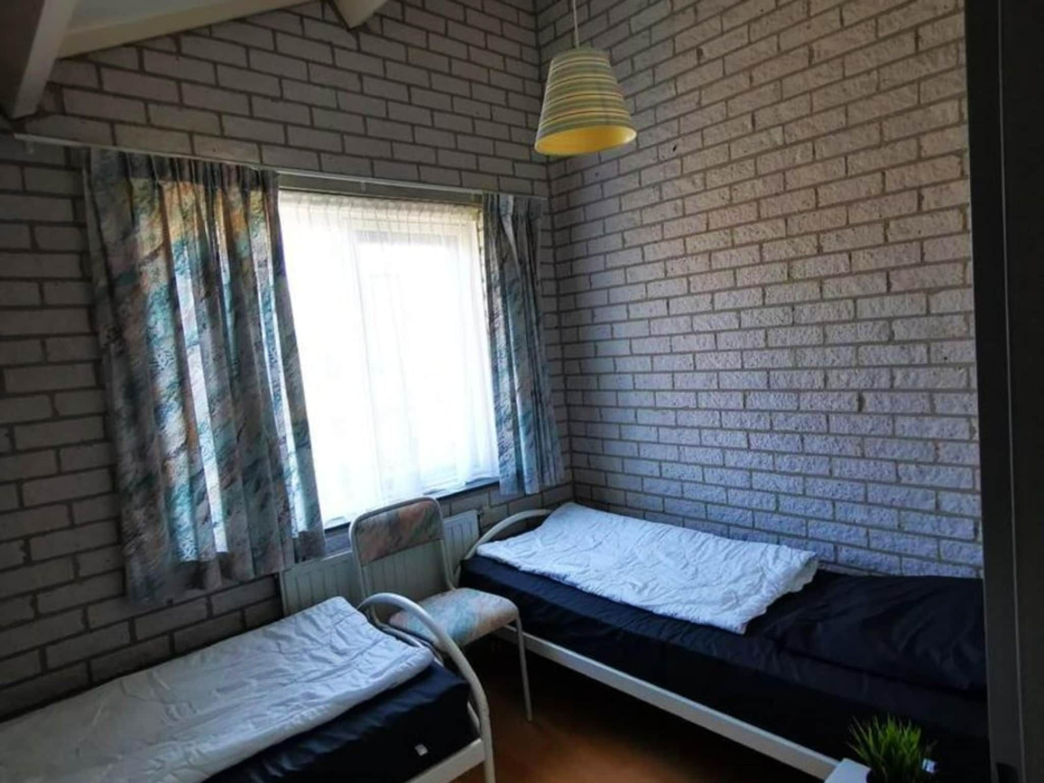 Een slaapkamer van Schoneveld 353 Strandparel Breskens in Breskens
