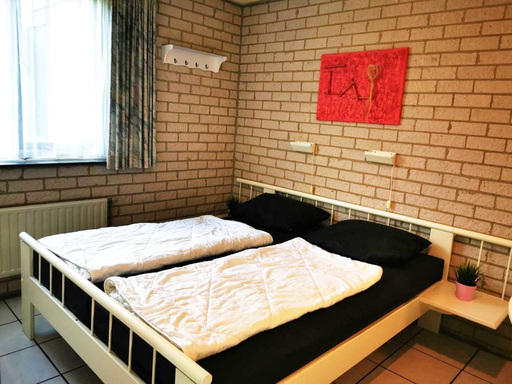 Een slaapkamer van Schoneveld 353 Strandparel Breskens in Breskens