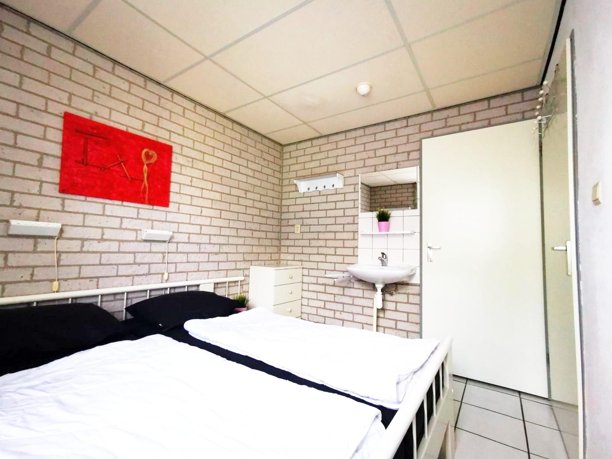 Een slaapkamer van Schoneveld 353 Strandparel Breskens in Breskens
