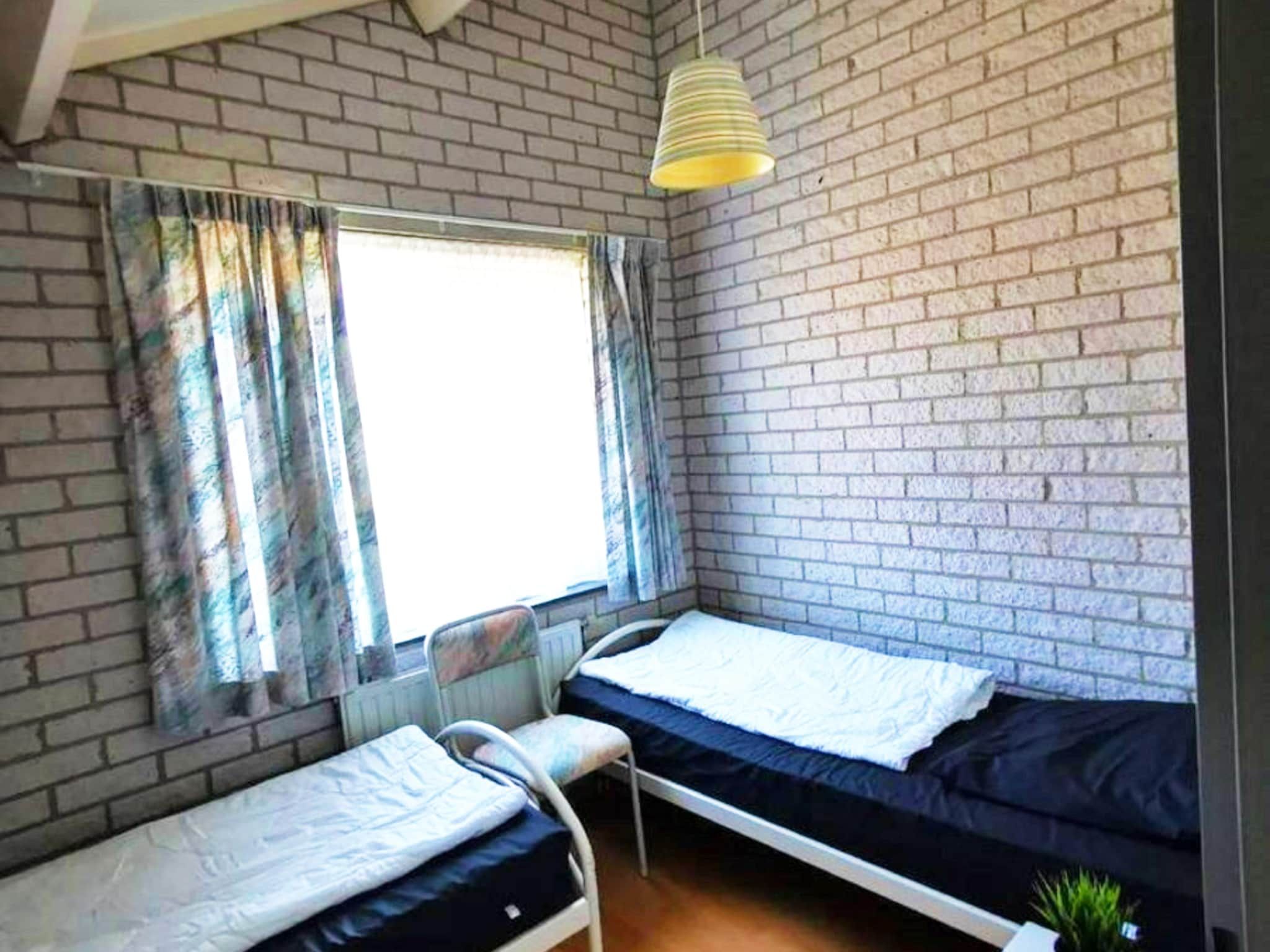Een slaapkamer van Schoneveld 353 Strandparel Breskens in Breskens