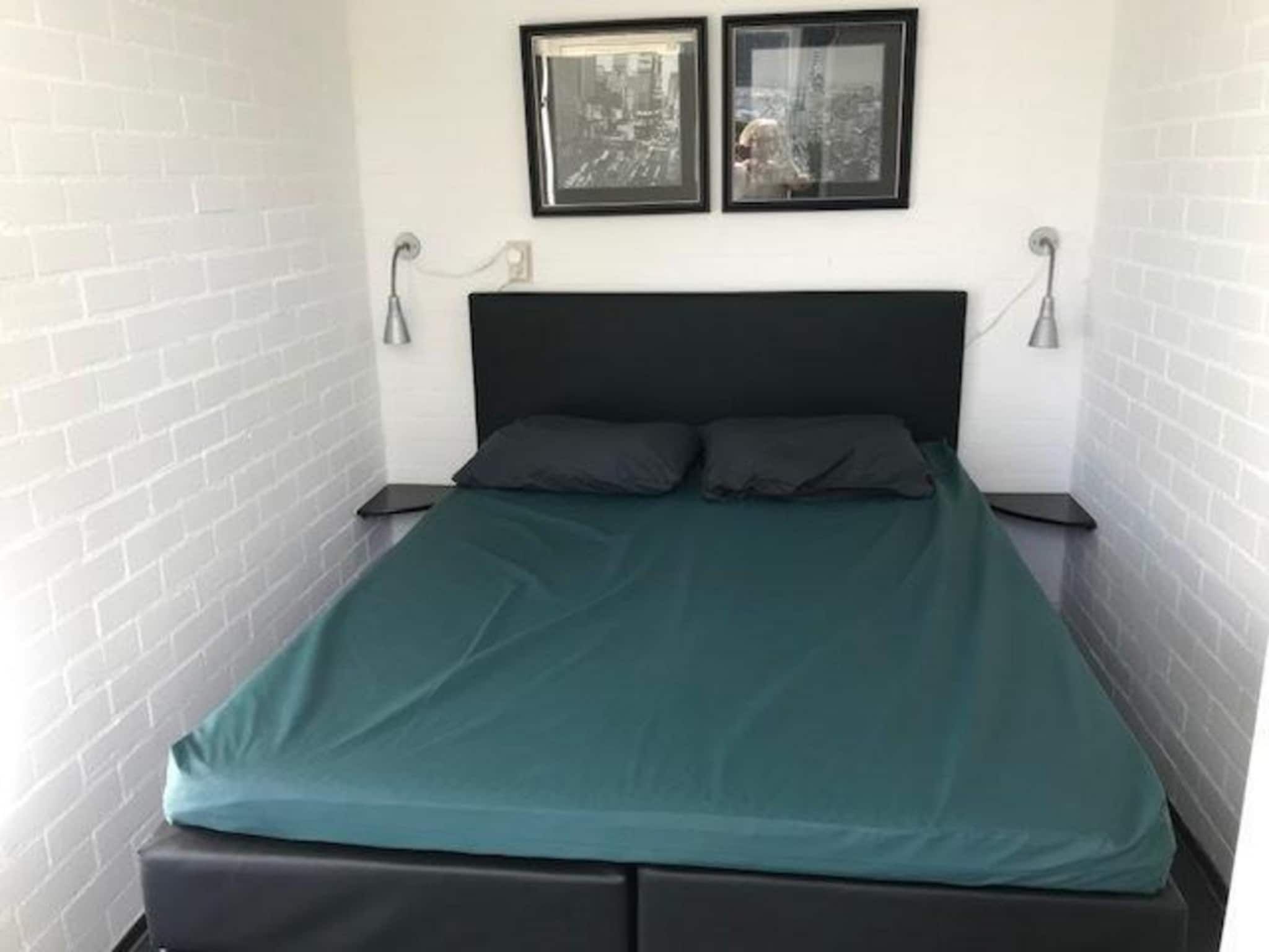 Een slaapkamer van Schoneveld 121 Duinroos Breskens in Breskens