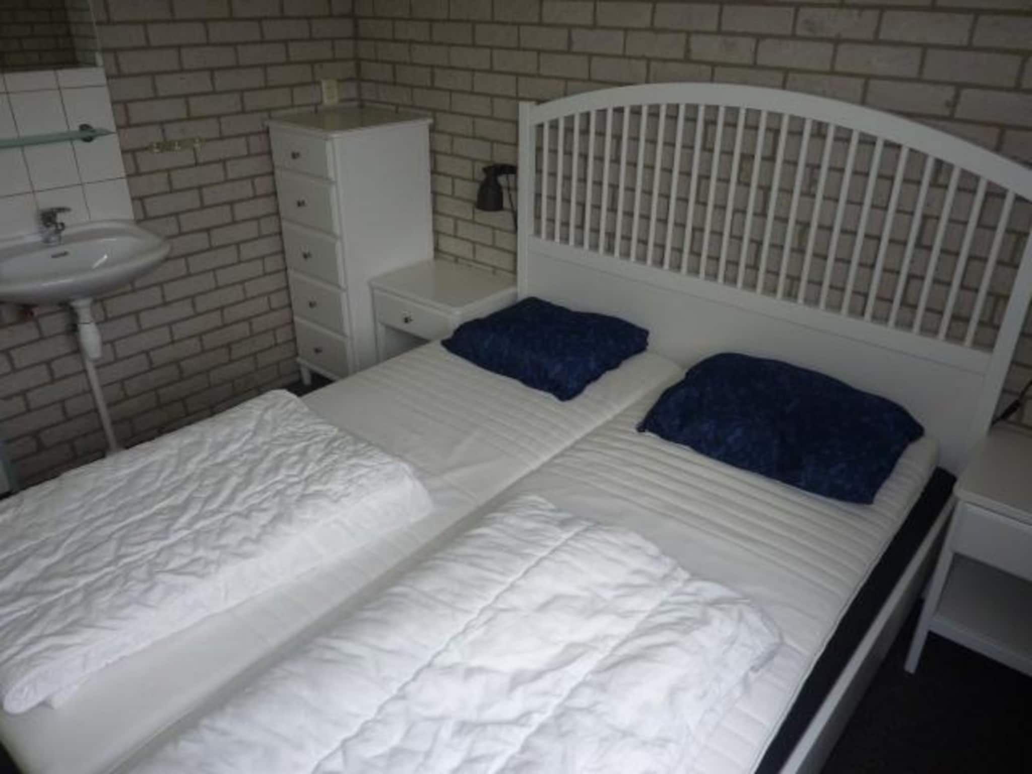 Een slaapkamer van Schoneveld 367 Strandparel Breskens in Breskens