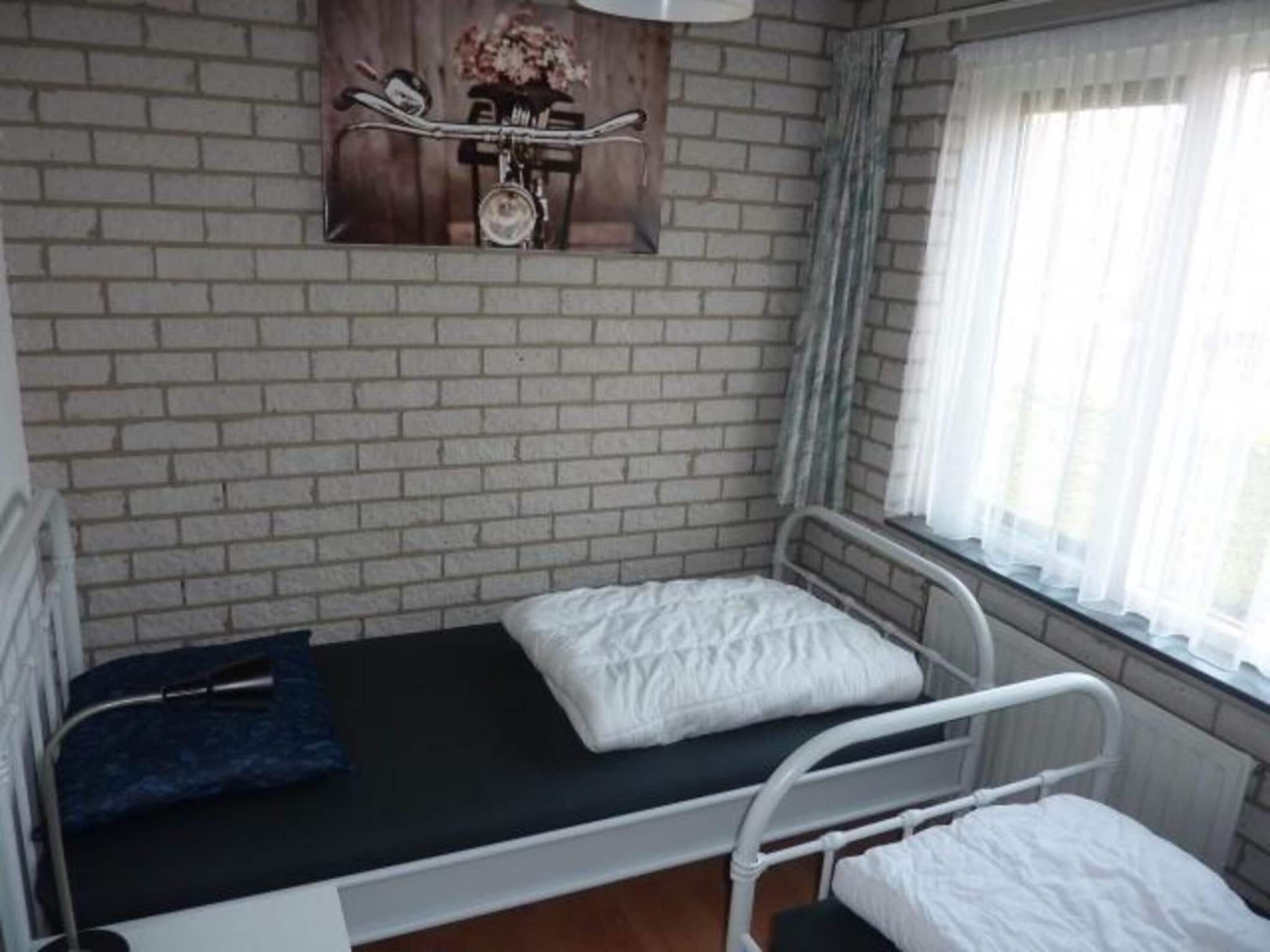 Een slaapkamer van Schoneveld 369 Strandparel Breskens in Breskens