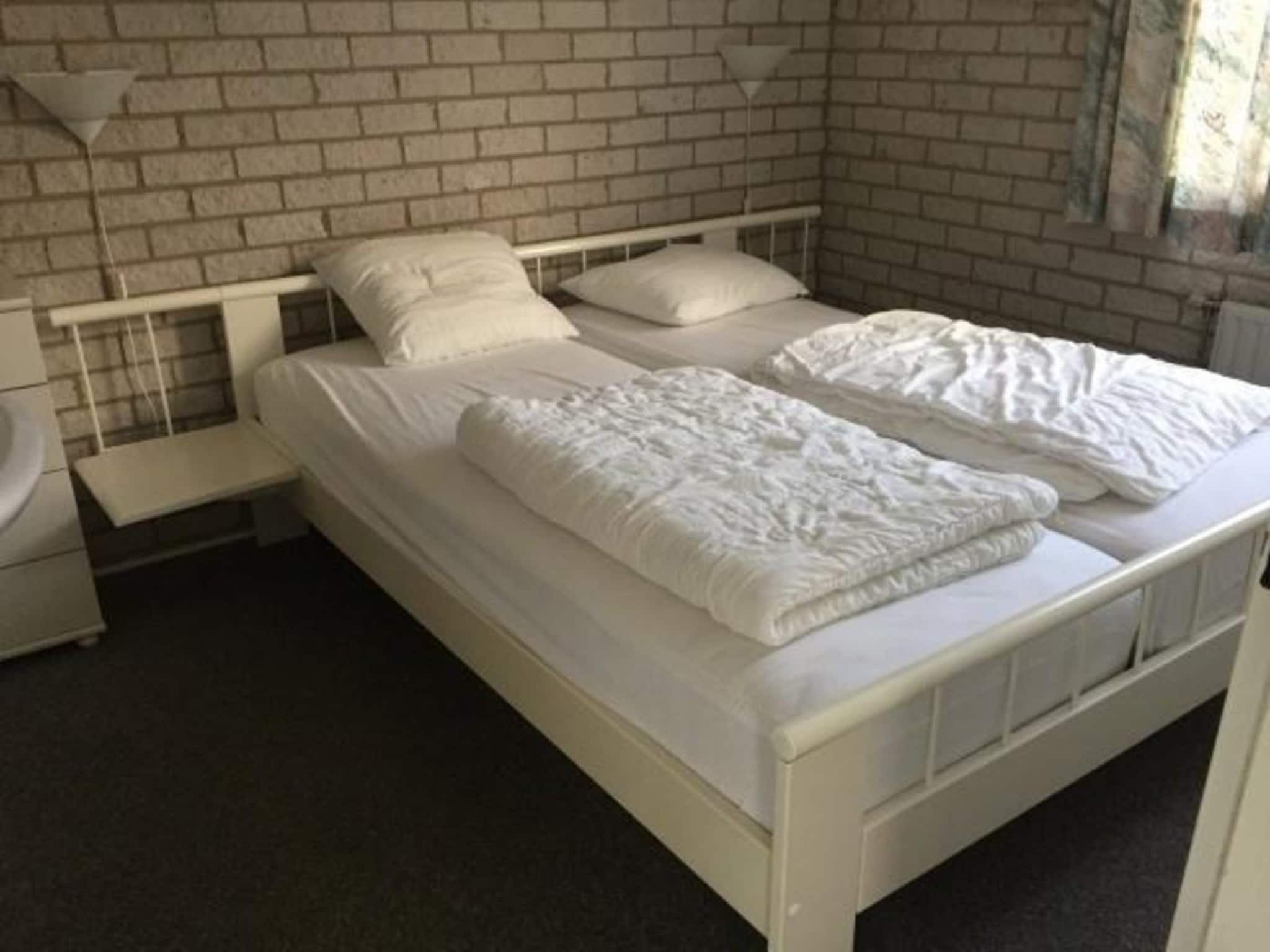 Een slaapkamer van Schoneveld 371 Strandparel Breskens in Breskens