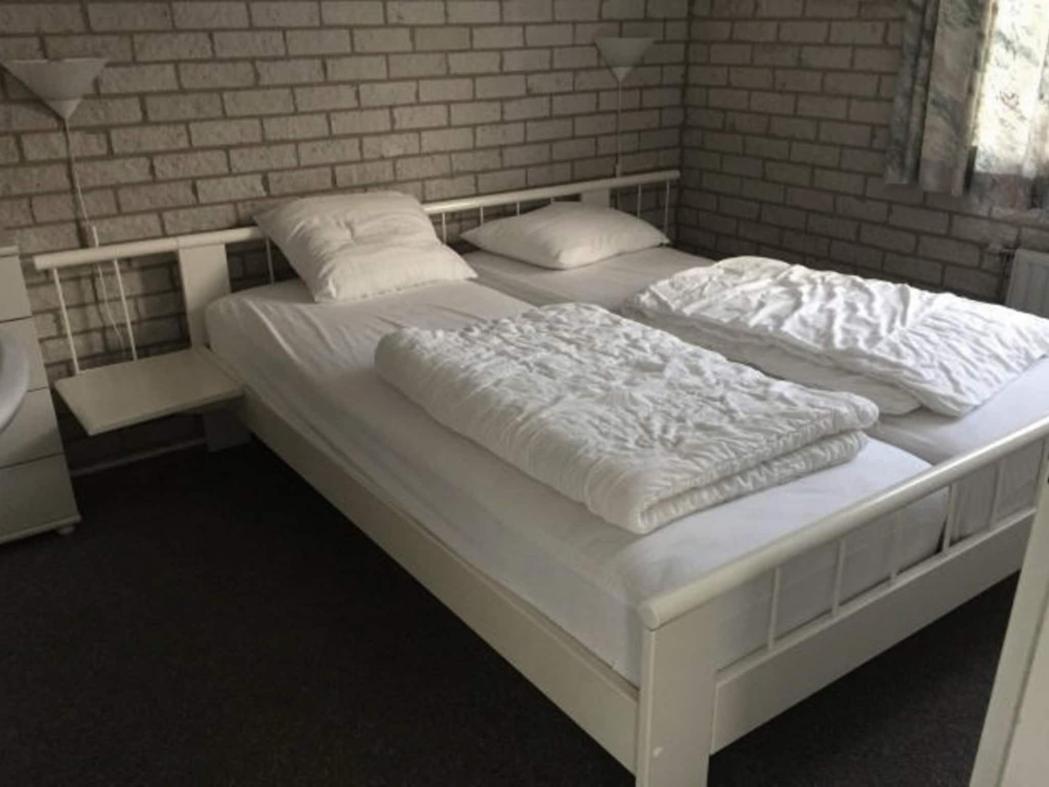 Een slaapkamer van Schoneveld 371 Strandparel Breskens in Breskens
