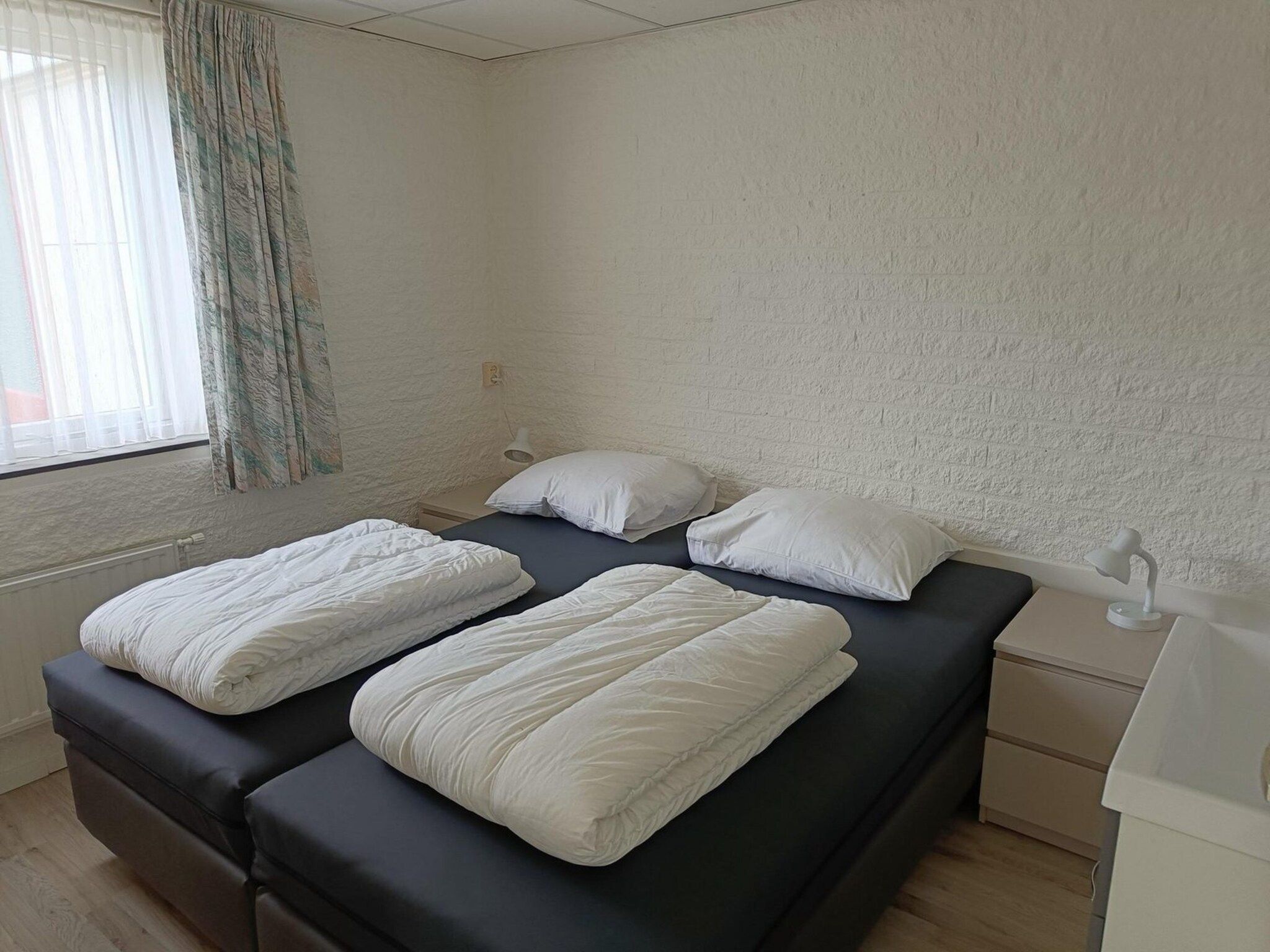 Een slaapkamer van Schoneveld 373 Strandparel Breskens in Breskens