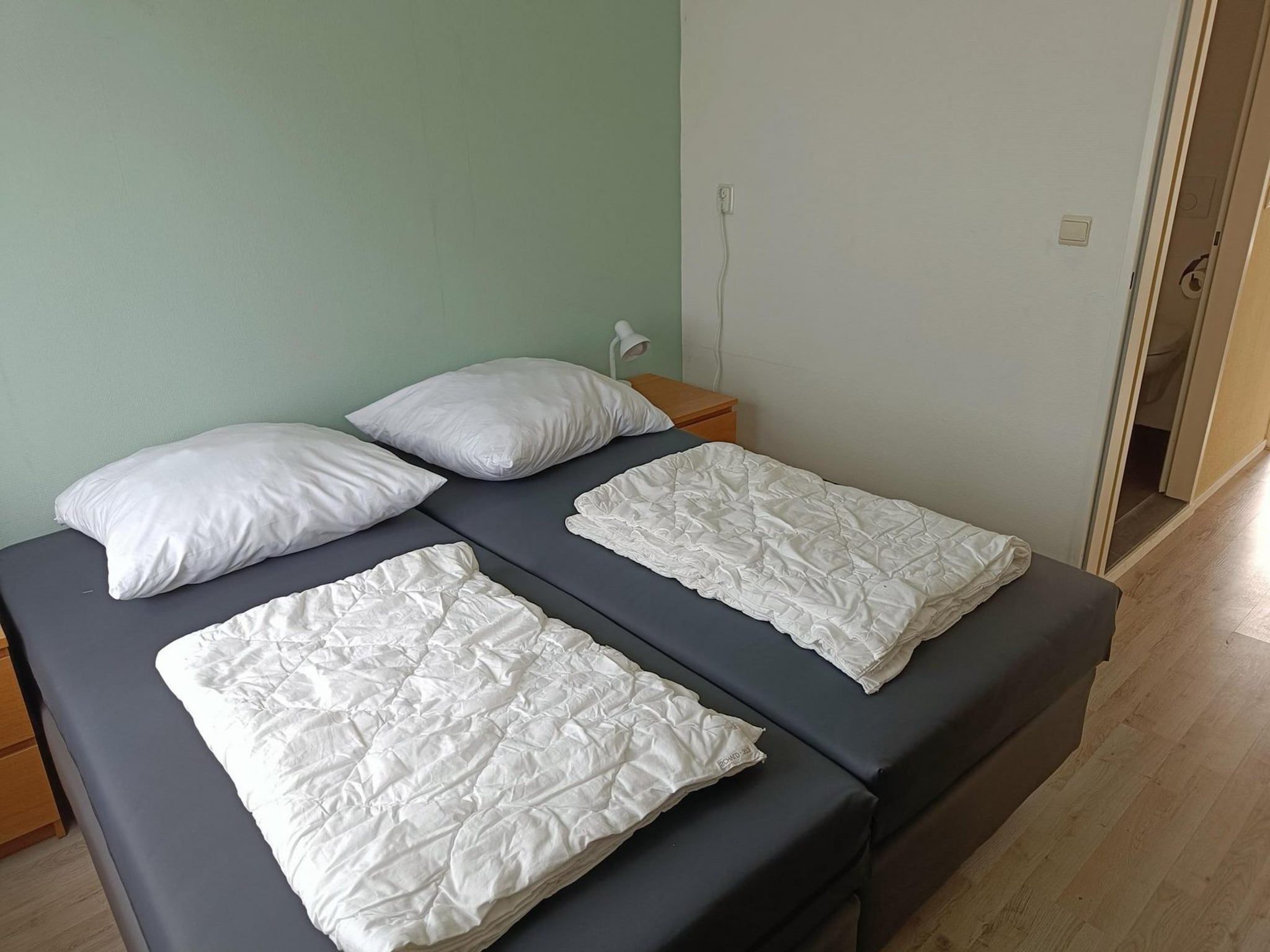 Een slaapkamer van Schoneveld 373 Strandparel Breskens in Breskens