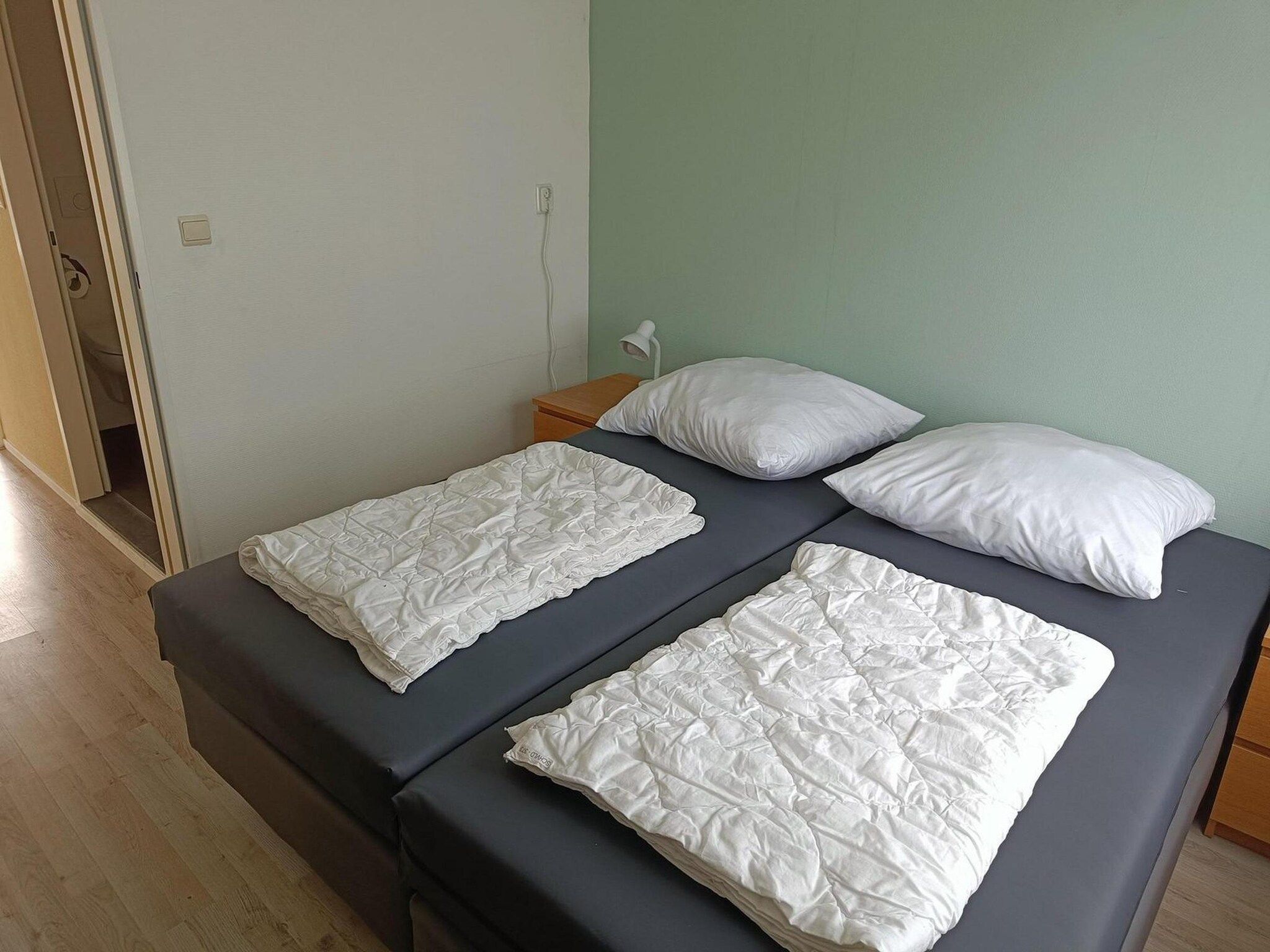 Een slaapkamer van Schoneveld 373 Strandparel Breskens in Breskens