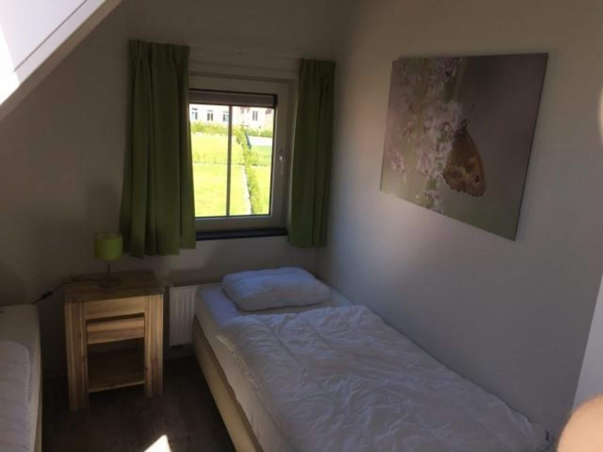 Een slaapkamer van Landgoed de Lente 12 Krokus Breskens in Breskens