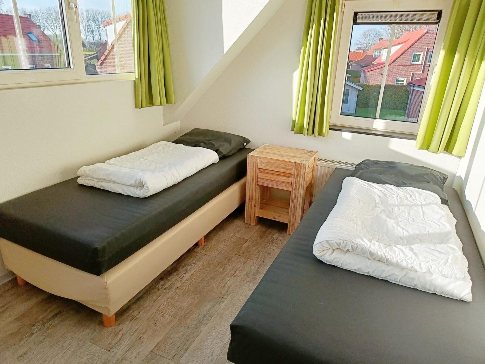Een slaapkamer van Landgoed de Lente 12 Krokus Breskens in Breskens