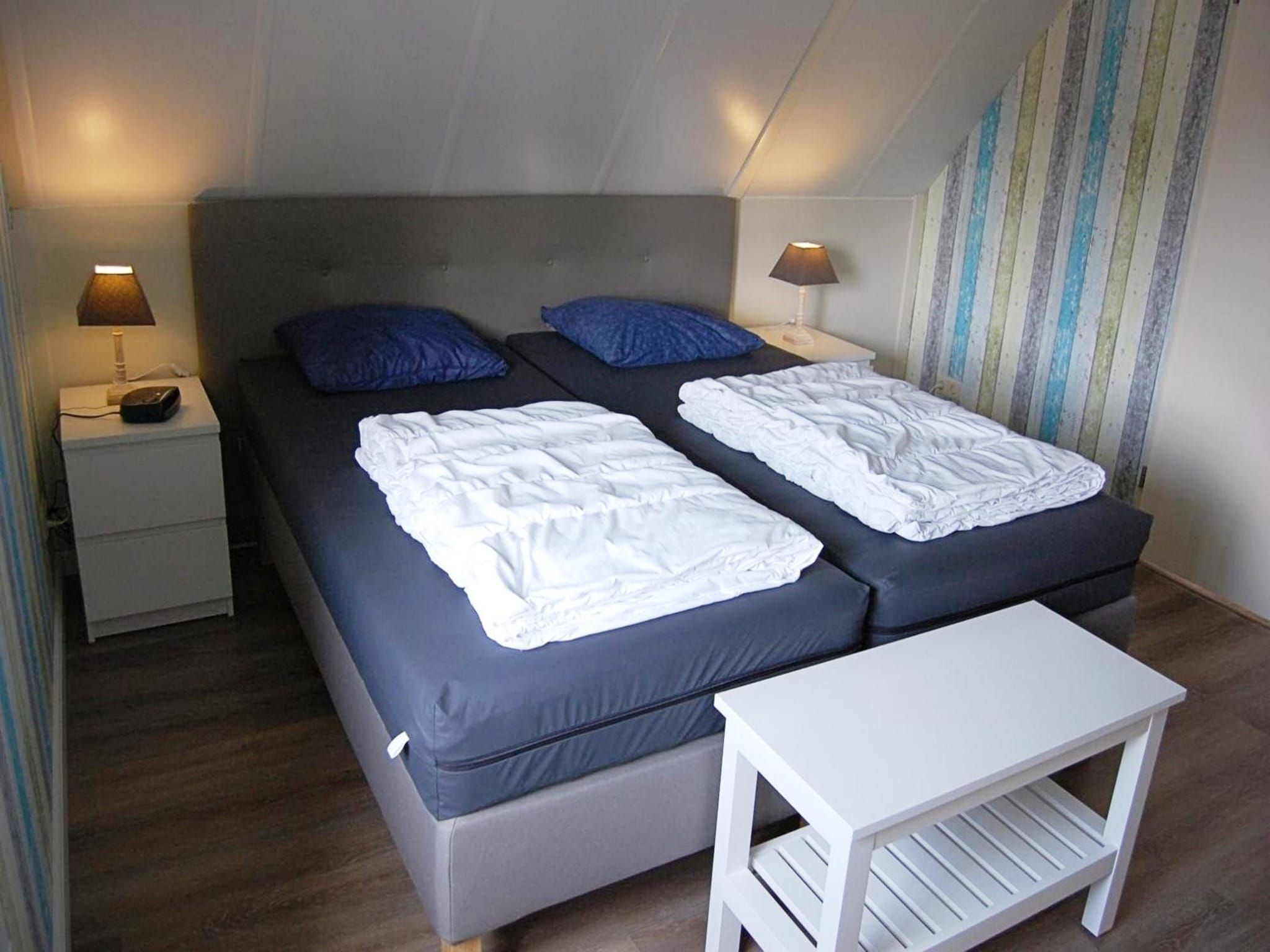 Een slaapkamer van Schoneveld 232 Stern Breskens in Breskens